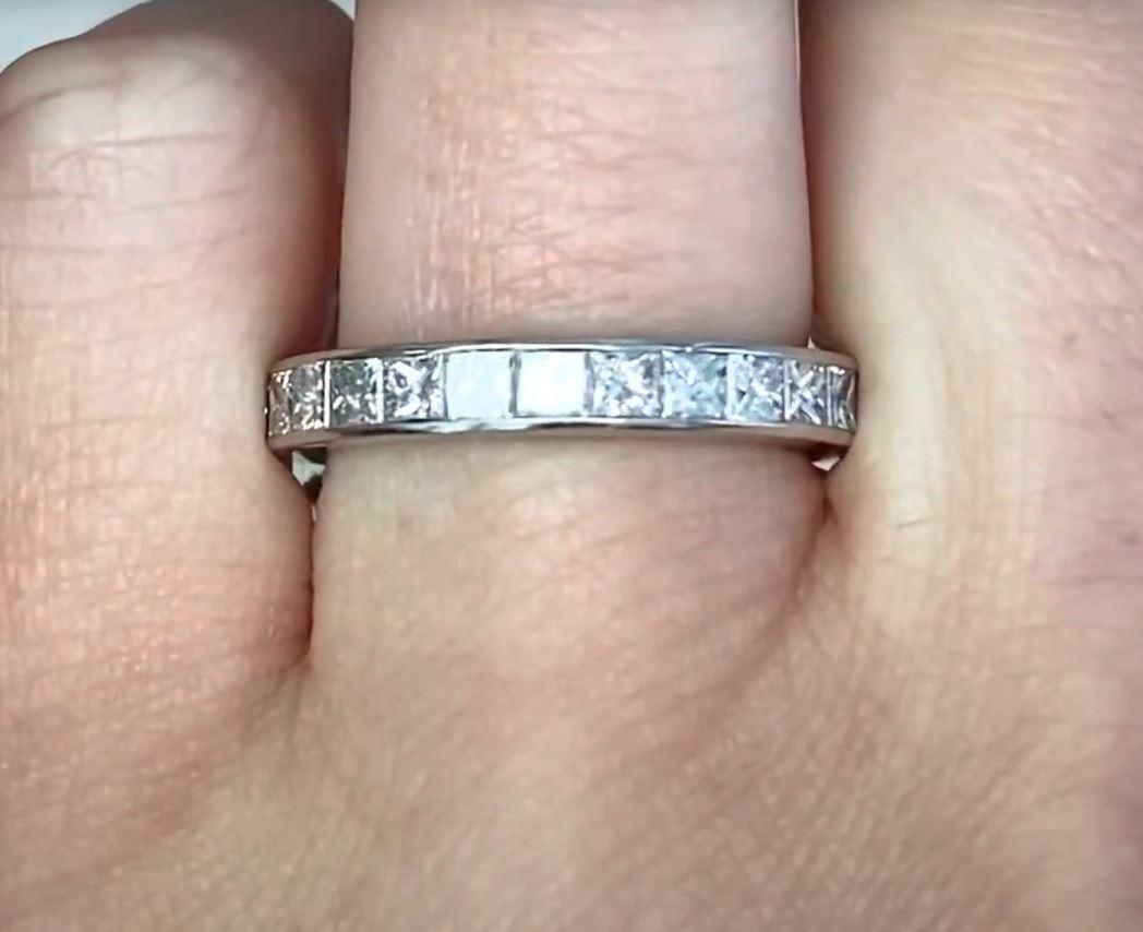 This exquisite princess-cut eternity band is a true testament to fine craftsmanship and timeless elegance. Handcrafted in platinum, this stunning piece showcases a seamless row of princess-cut diamonds, each meticulously set to create an unbroken