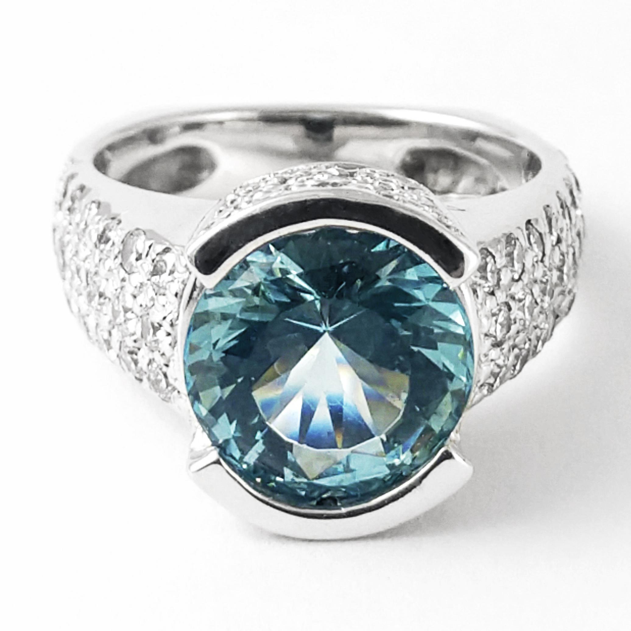 This glamorous and timeless 18K white gold women's ring is featuring a 2.75ct round aquamarine that is exhibiting deep turquoise blue tiffany hues. The gemstone is in a bezel-set style band for easy maintenance and protection. This original Cornelis
