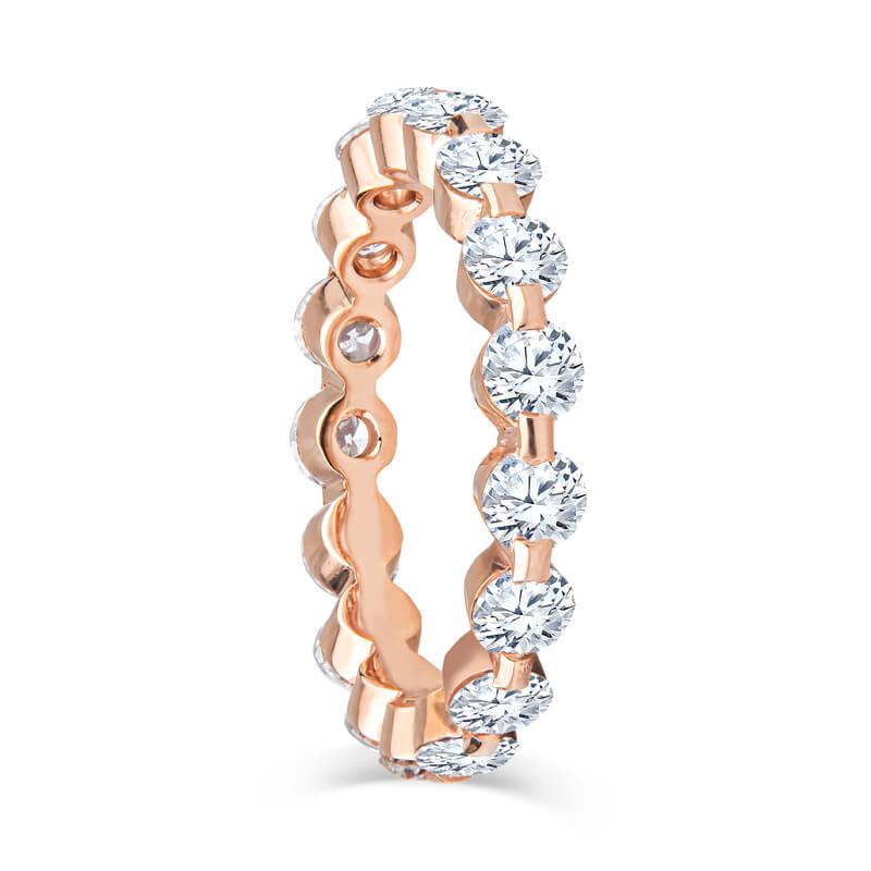 This gorgeous eternity band features 2.75ct total weight in round diamonds, set in a beautifully crafted 18kt rose gold shared prong band. The ring is a size 7 currently; contact us for sizing options. The diamonds are of VS1 clarity, E-F color;