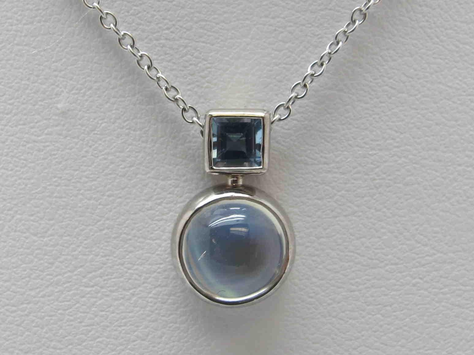 Once in a blue moon you see moonstones the quality of this one!  It is completely transparent, save for the blue, billowing light that moves across the stone.  Set in a  simple necklace, it  can be worn for all occasions. The moonstone measures  7mm