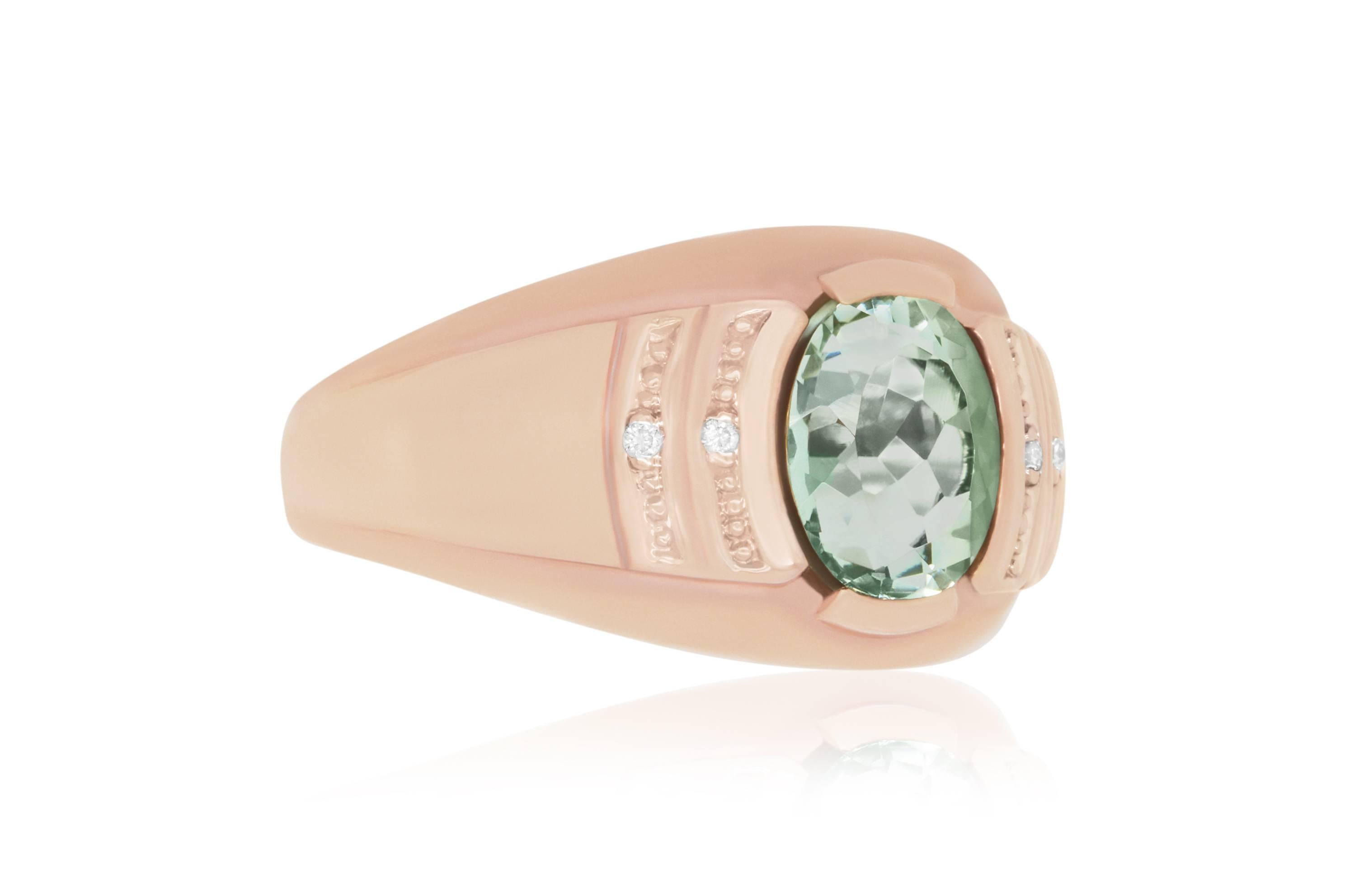 This unique oval 2.76 carat Green Amethyst is set in a 14k Rose Gold with 4 accent white diamonds, framing this beautifully vibrant green color in sparkle and shine!

Material: 14k Rose Gold
Colored Diamond: 1 Oval Green Amethyst at 2.76