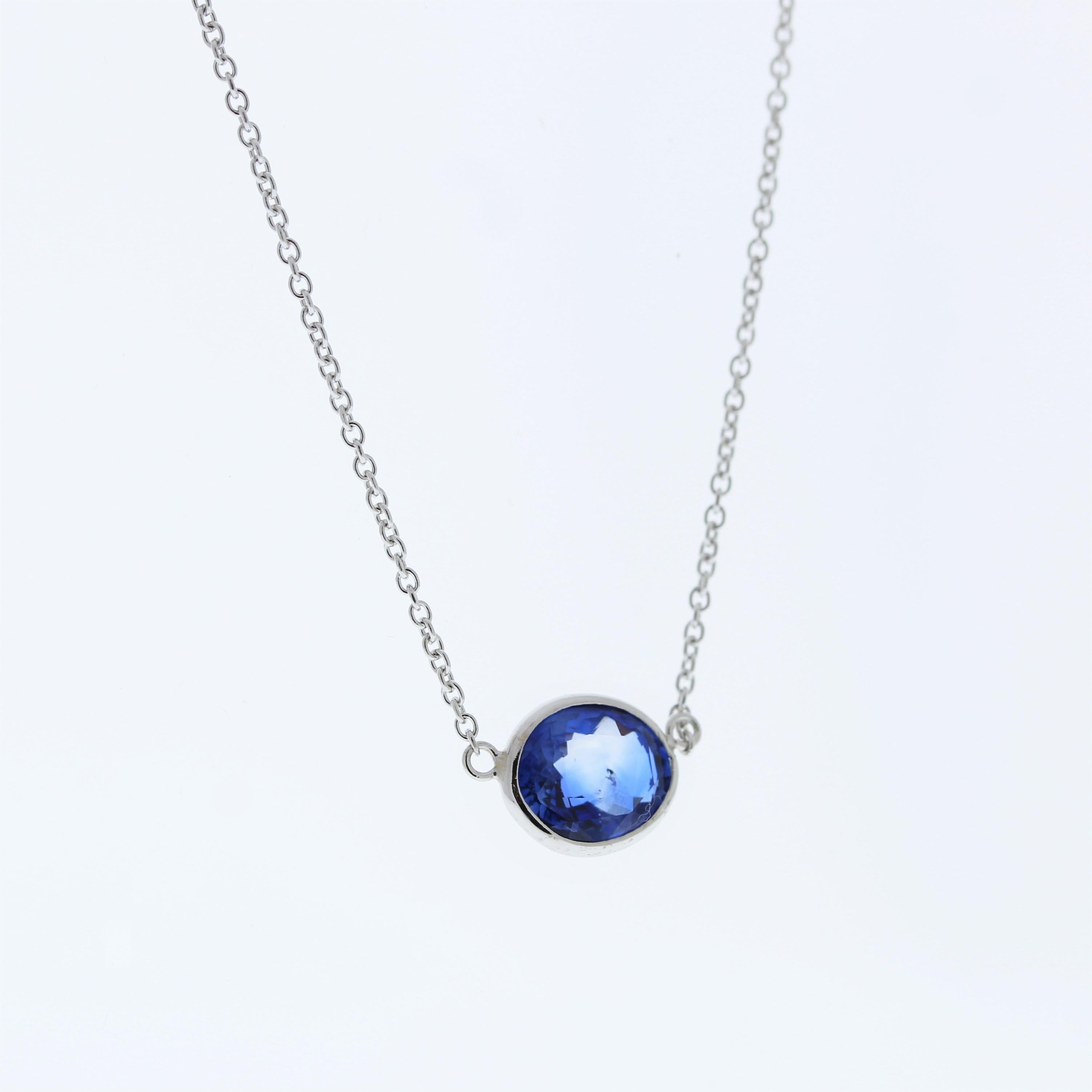 The necklace features a 2.76-carat oval-cut blue sapphire set in a 14 karat white gold pendant or setting. The combination of the blue sapphire and the white gold setting is likely to create an elegant and captivating piece of jewelry that can