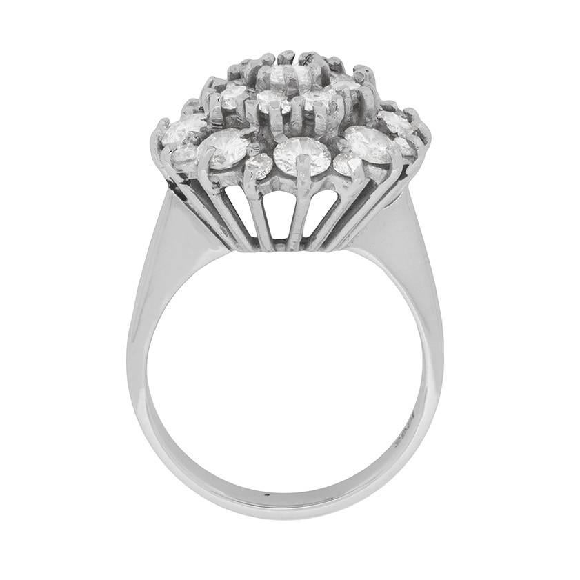 This glamorous cocktail ring scintillates in 18 carat white gold with 2.76 carats of diamonds!

The sizeable array of round brilliant cut diamonds is arranged in three concentric circles. Adding an unexpected and stylish touch, the diamonds at the