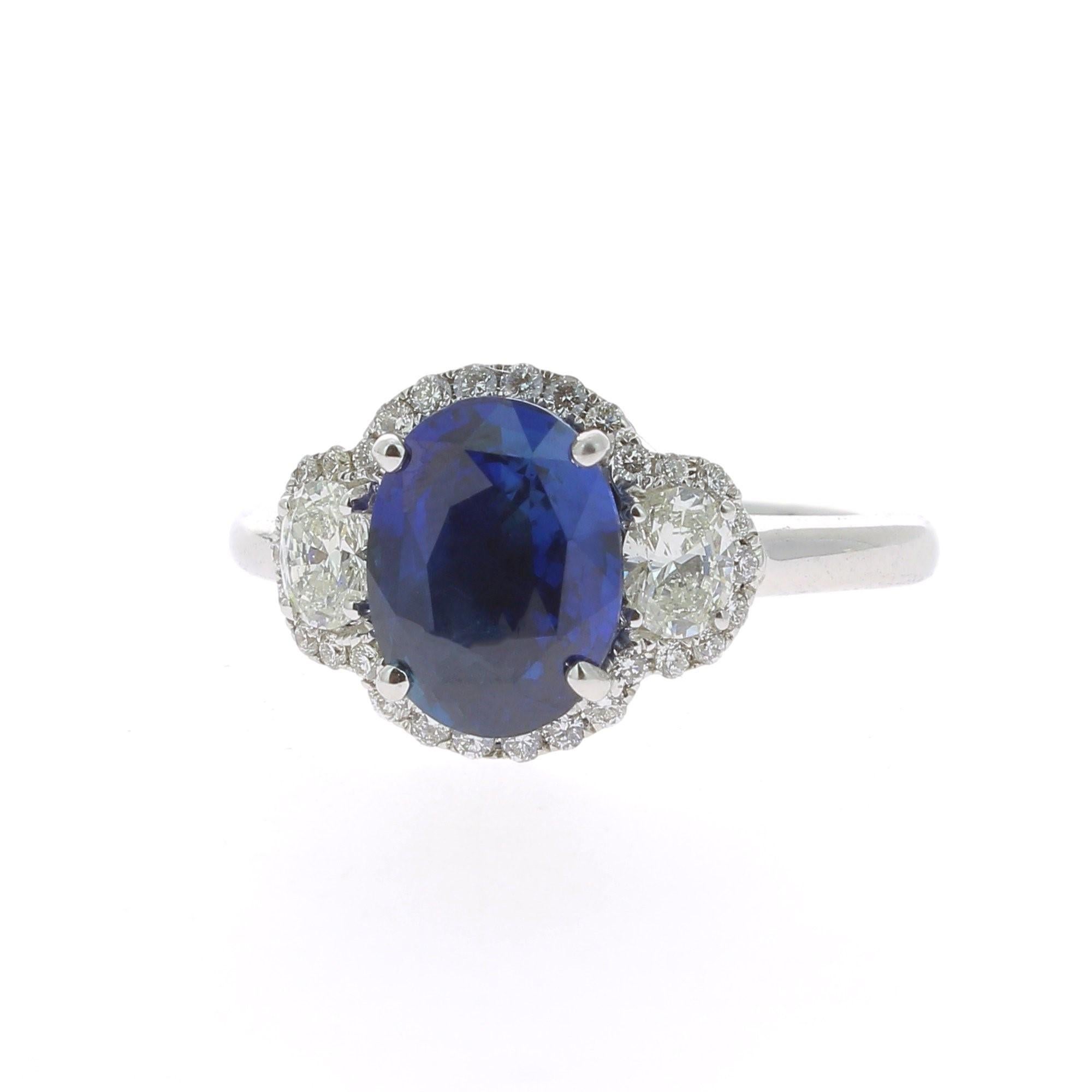 Oval Cut 2.77 Carat Blue Sapphire Cocktail Ring Set with Oval and Round White Diamond 18K For Sale