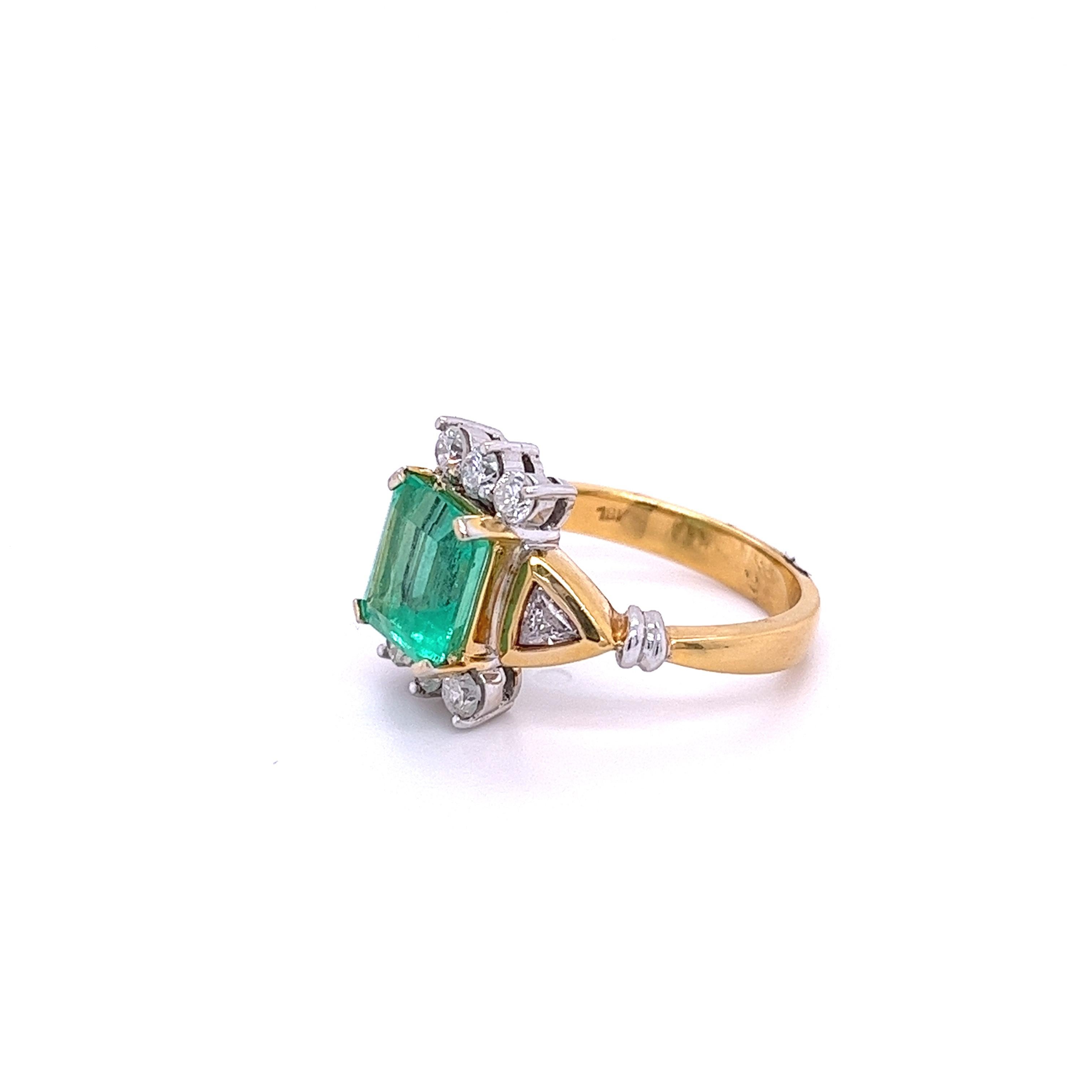 Emerald Cut 2.77 Carat Colombian Emerald and Trillion Cut Diamonds in 18k Yellow Gold Ring For Sale