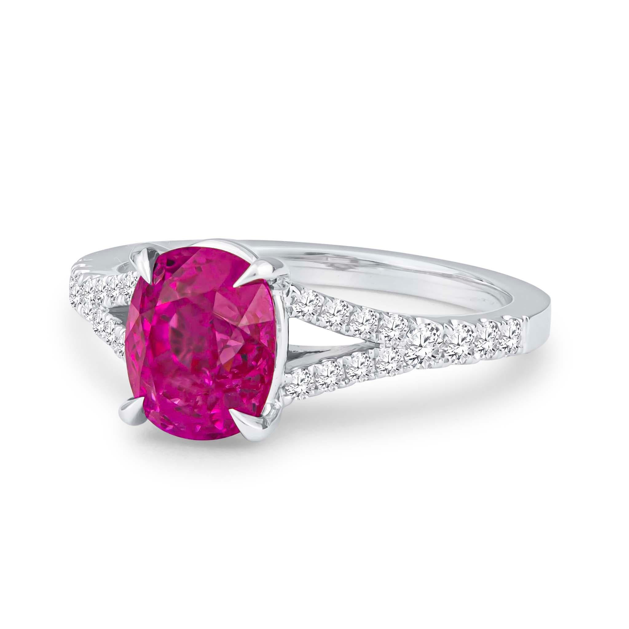 Gorgeous 18K white gold split shank diamond engagement ring showcasing one GIA certified 2.77 carat cushion cut natural purple-pink Burma sapphire. The center stone is adorned by 0.36 carats of fine round brilliant cut diamonds that have been