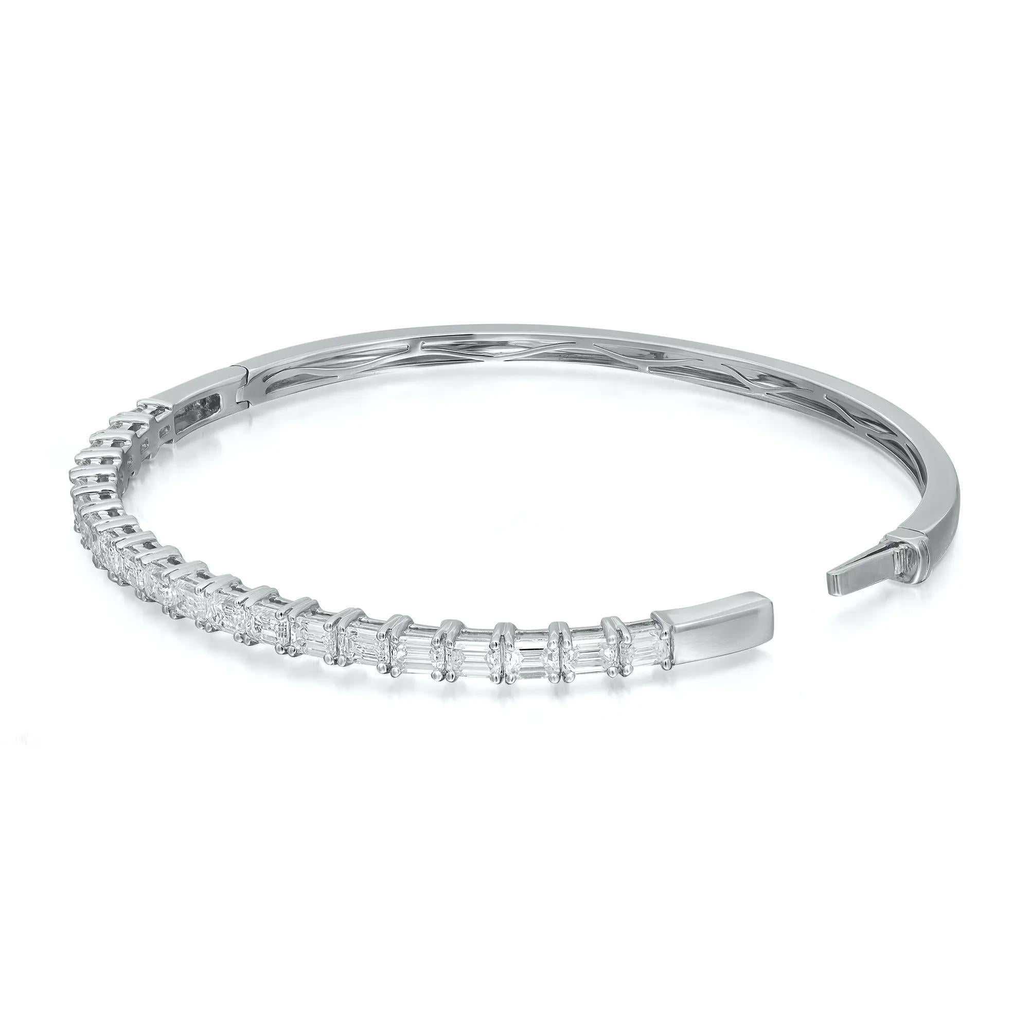 Experience the epitome of sophistication with our 2.77 Carat Emerald Cut Diamond Bangle Bracelet in 18K White Gold, meticulously crafted with a touch of brilliance. The stunning emerald-cut diamond, boasting 2.77 carats of pure elegance, is