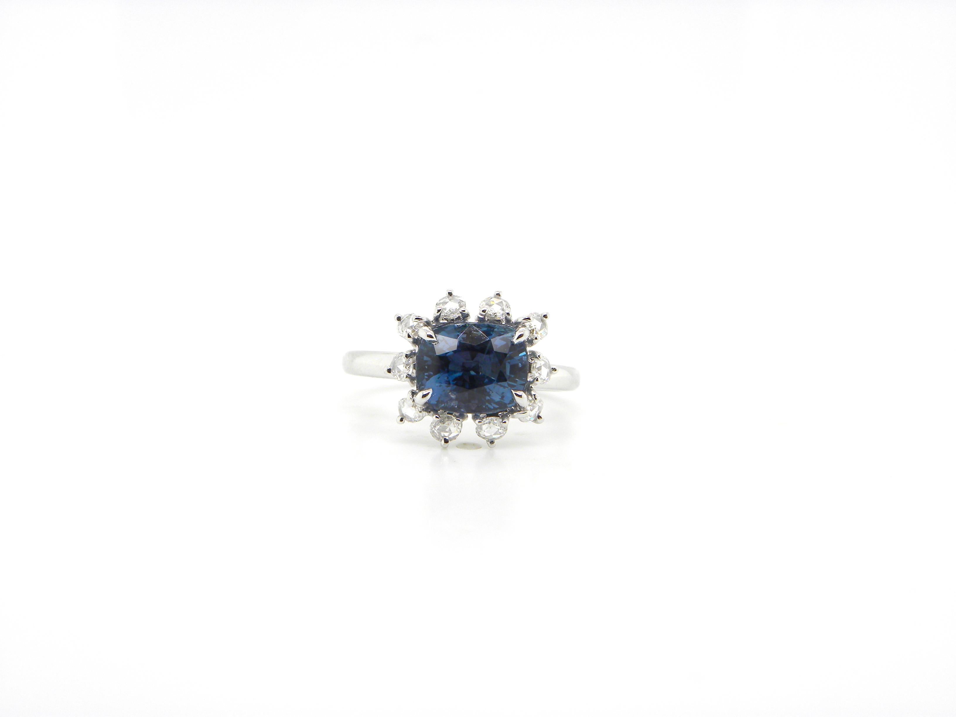 2.77 Carat GRS Certified Unheated Burmese Sapphire and Diamond Engagement Ring:

An elegant ring, it features a gorgeous GRS certified cushion-cut unheated Burmese blue sapphire weighing 2.77 carat, surrounded by a halo of super-white rose cut