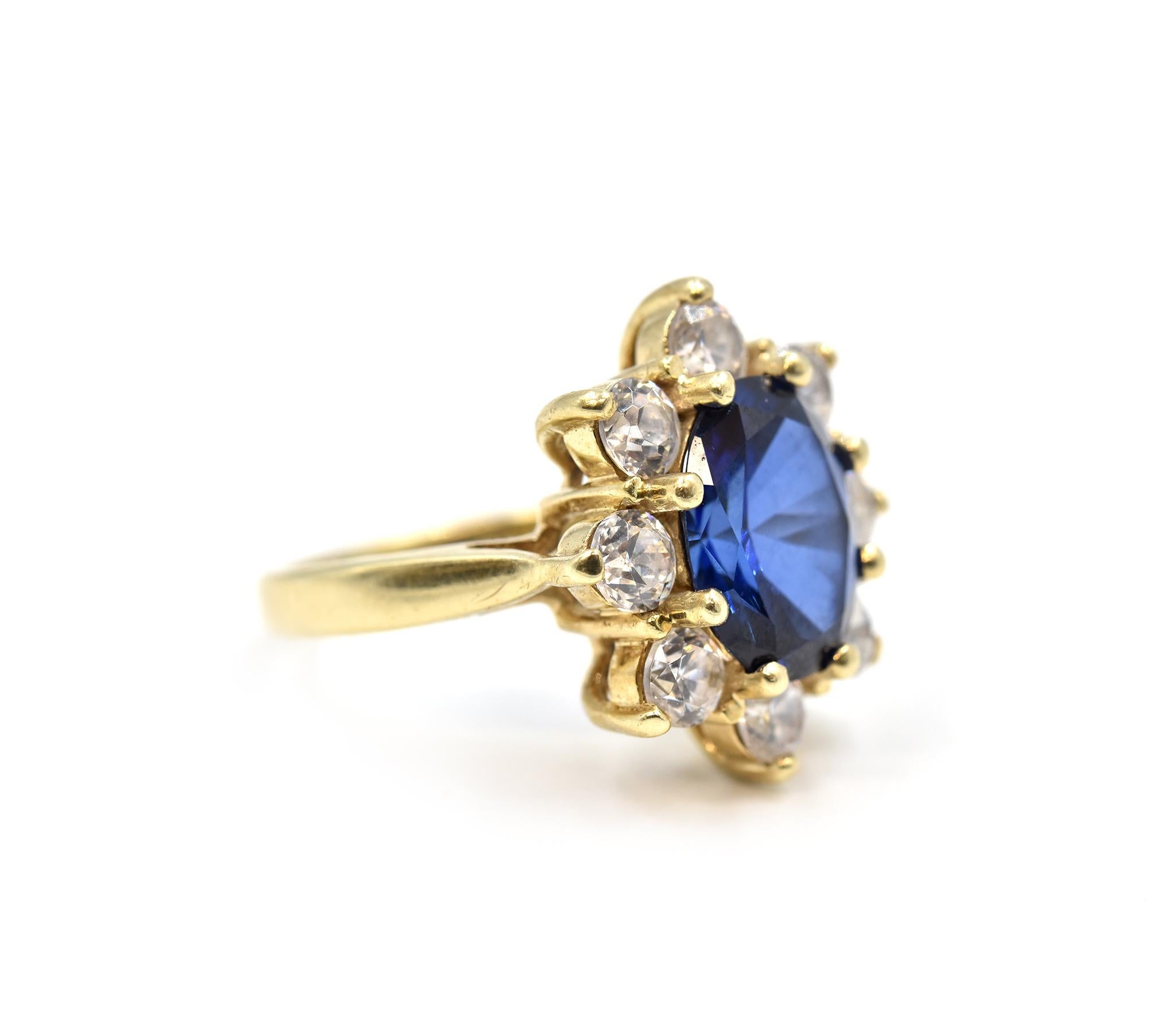 Designer: custom design
Material: 10k yellow gold
Sapphire: 2.77 carat weight oval blue sapphire gemstone
Diamonds: eight round brilliant cut diamonds = 0.96 carat total weight
Dimensions: ring is 5/8-inch long and 1/2-inch wide
Ring Size: 4 1/4