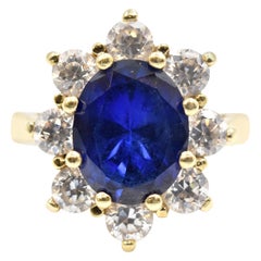 2.77 Carat Oval Cut Sapphire and Diamond Ring 10 Karat Yellow Gold