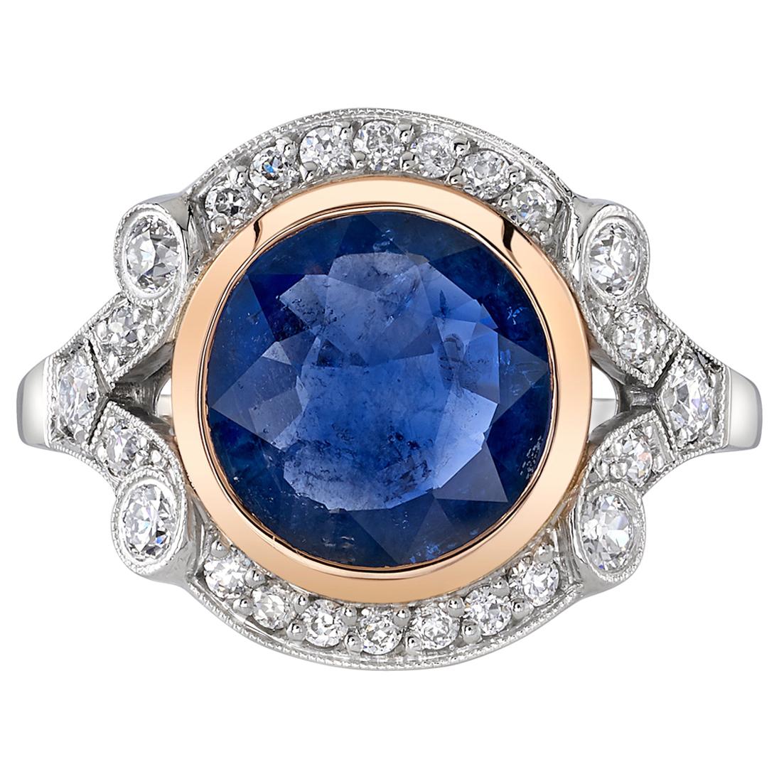 2.77 Carat Round Cut Blue Sapphire Set in a Rose Gold and Platinum Mounting.