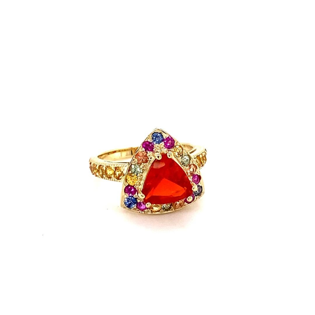 2.77 Carat Trillion Cut Fire Opal Sapphire 14K Yellow Gold Cocktail Ring

This ring has a beautiful 1.19 Carat Trillion Cut Fire Opal as its center stone and is beautifully surrounded by 20 Multi-Colored Sapphires that weigh 0.92 Carats and 12