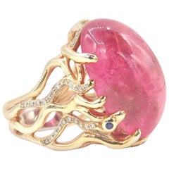 27.78 Carat Cabochon Pink Rubellite 18K Gold Ring with Diamond and Blue Sapphire