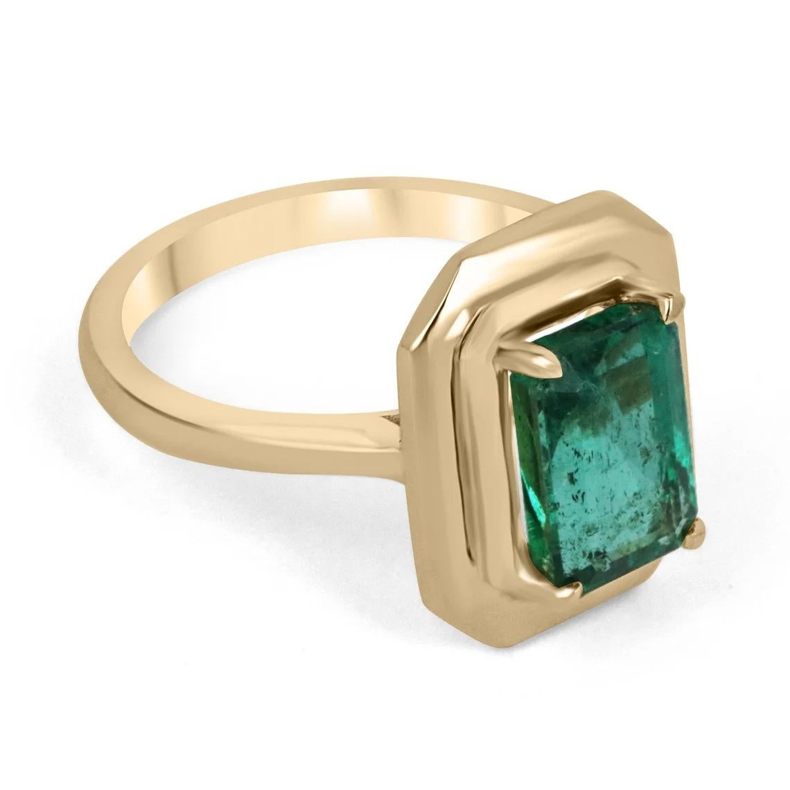 Displayed is a classic emerald solitaire engagement or right-hand ring. This spectacular piece features a 2.77-carat, natural emerald cut emerald from the origins of Zambia. The center stone showcases a vivacious deep dark green color that enthralls