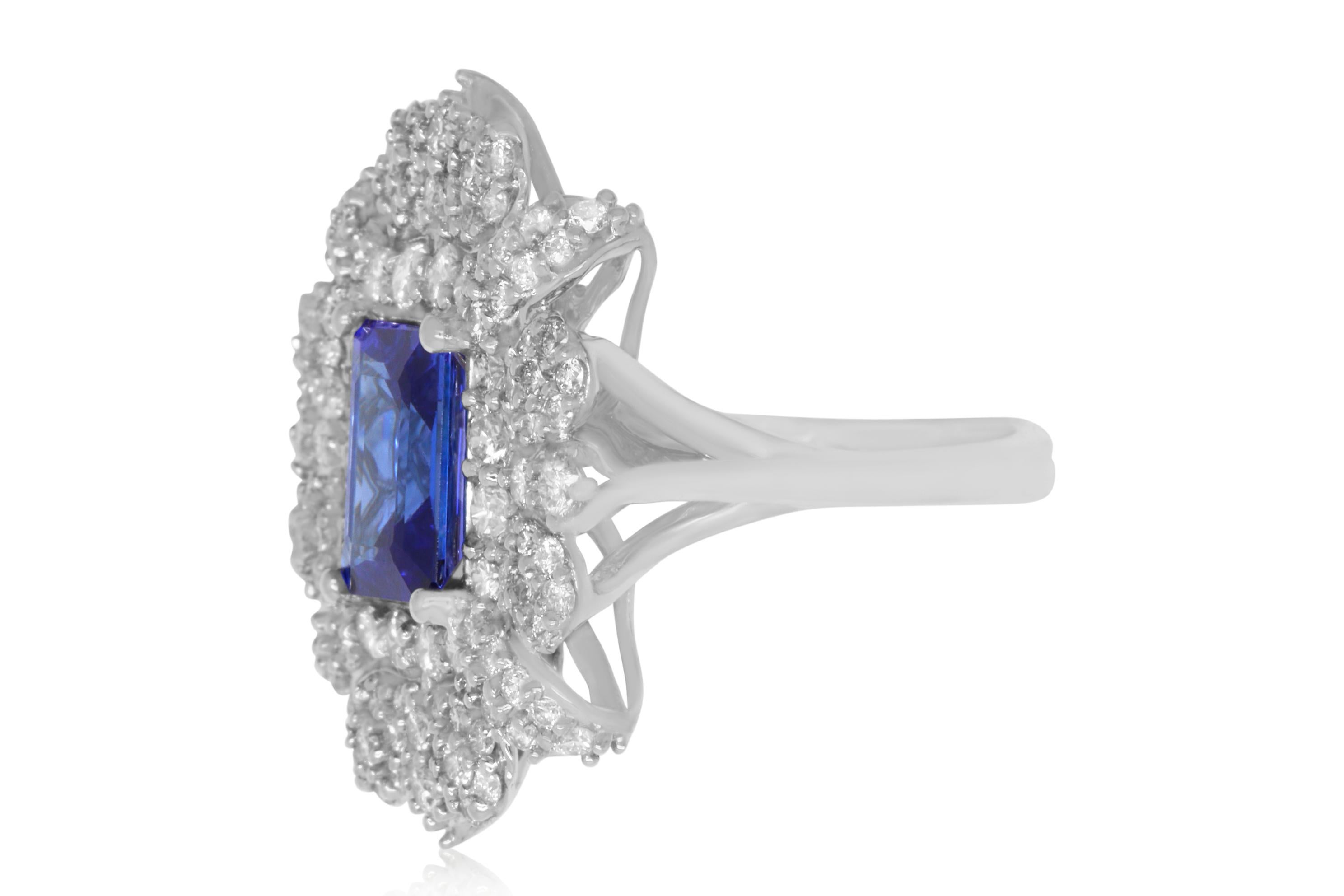 A stunning 2.78 Carat Emerald Cut Tanzanite is framed by dazzling round white diamonds totaling 2.22 Carats. A beautiful and chic design for colored jewelry lovers everywhere!

Material: 14k White Gold
Gemstones: 1 Emerald Cut Tanzanite at 2.78
