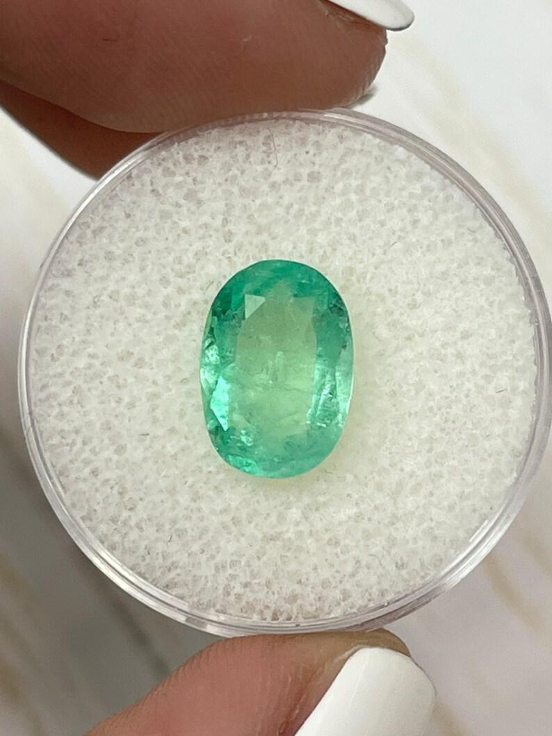 Stone: Emerald
Weight: 2.78-carats
Shape: Oval Cut
Clarity: Transparent
Luster: Very Good
Color: Light Green
Measurements: 11.60mm x 8.19mm x 4.73mm
Geographic Origin: Colombia
Treatment: Natural, Oiling

Comments: Due to their growth conditions in