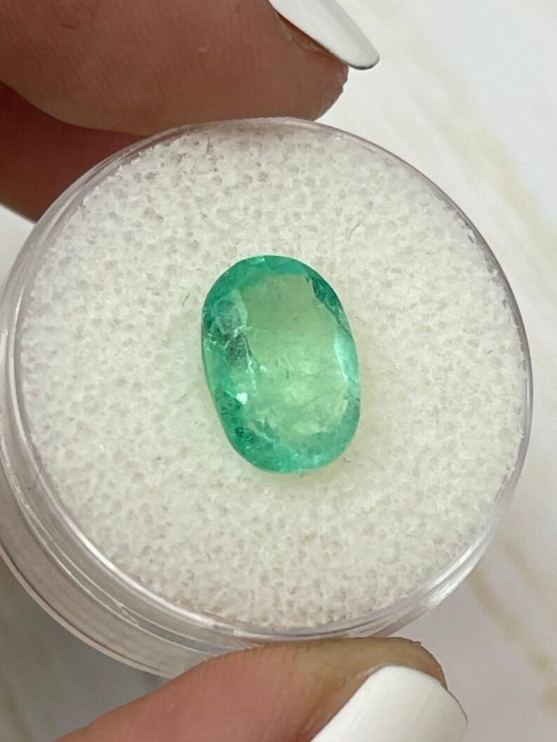 2.78 Carat Light Yellowish Green Colombian Emerald Oval Cut - May Birthstone Gem In New Condition For Sale In Jupiter, FL