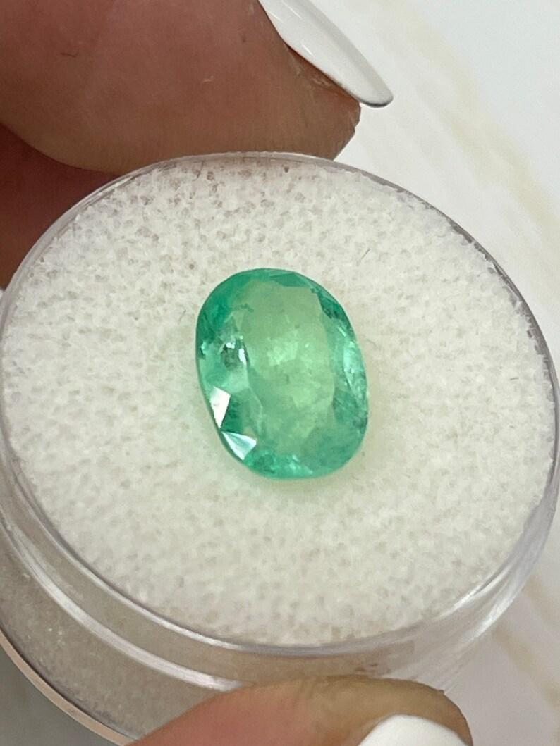 Women's or Men's 2.78 Carat Light Yellowish Green Colombian Emerald Oval Cut - May Birthstone Gem For Sale