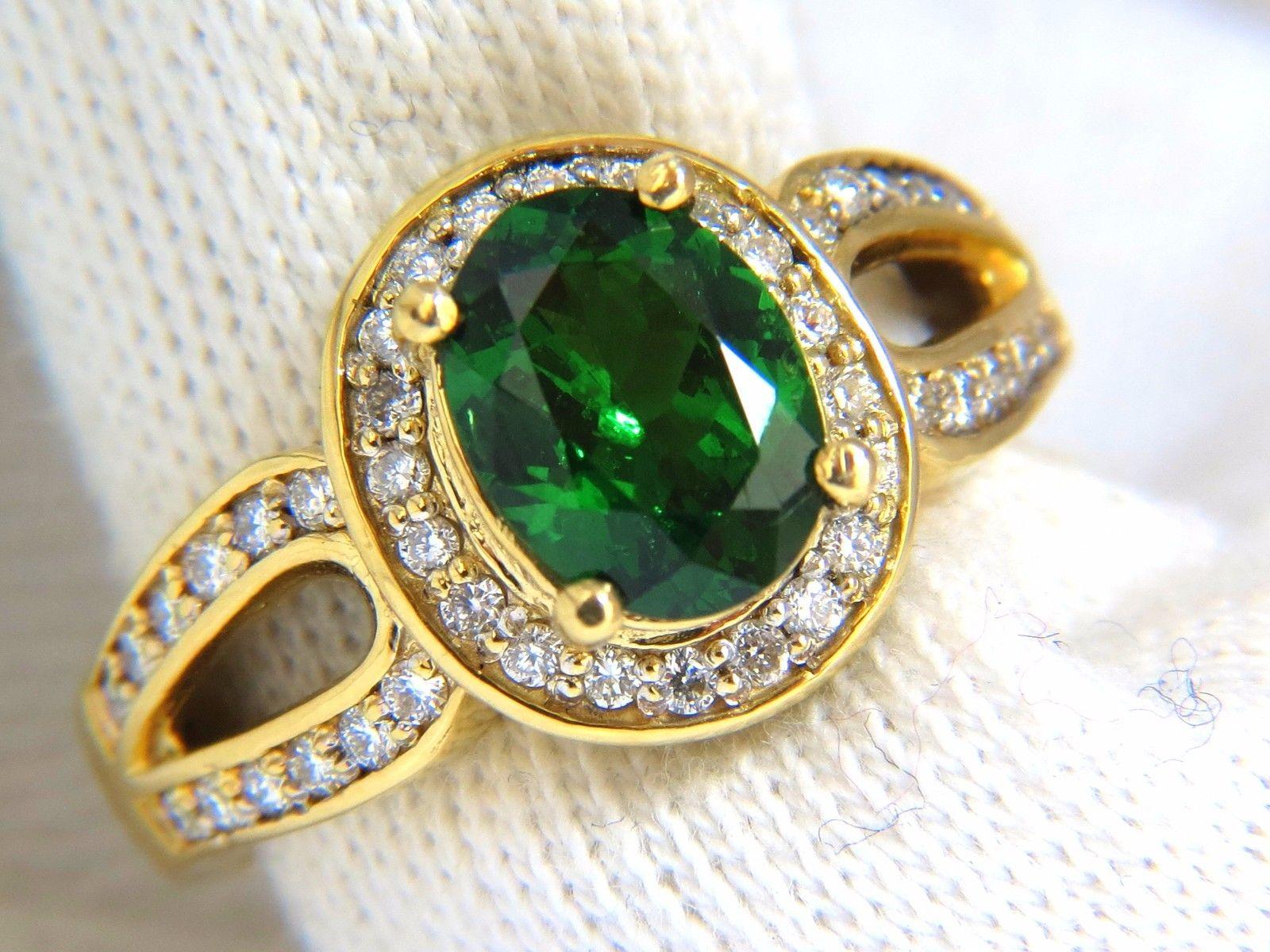 1.78ct. Natural tsavorite Ring

8.9 X 7.0mm

Full cut oval brilliant 

Clean Clarity & Transparent

Vivid Mint Green



1.00ct. round Shaped diamonds.

G-color Vs-2

  18kt. green gold

8.2 grams

Ring Current size: 7

Ring is 12.5mm wide

Depth