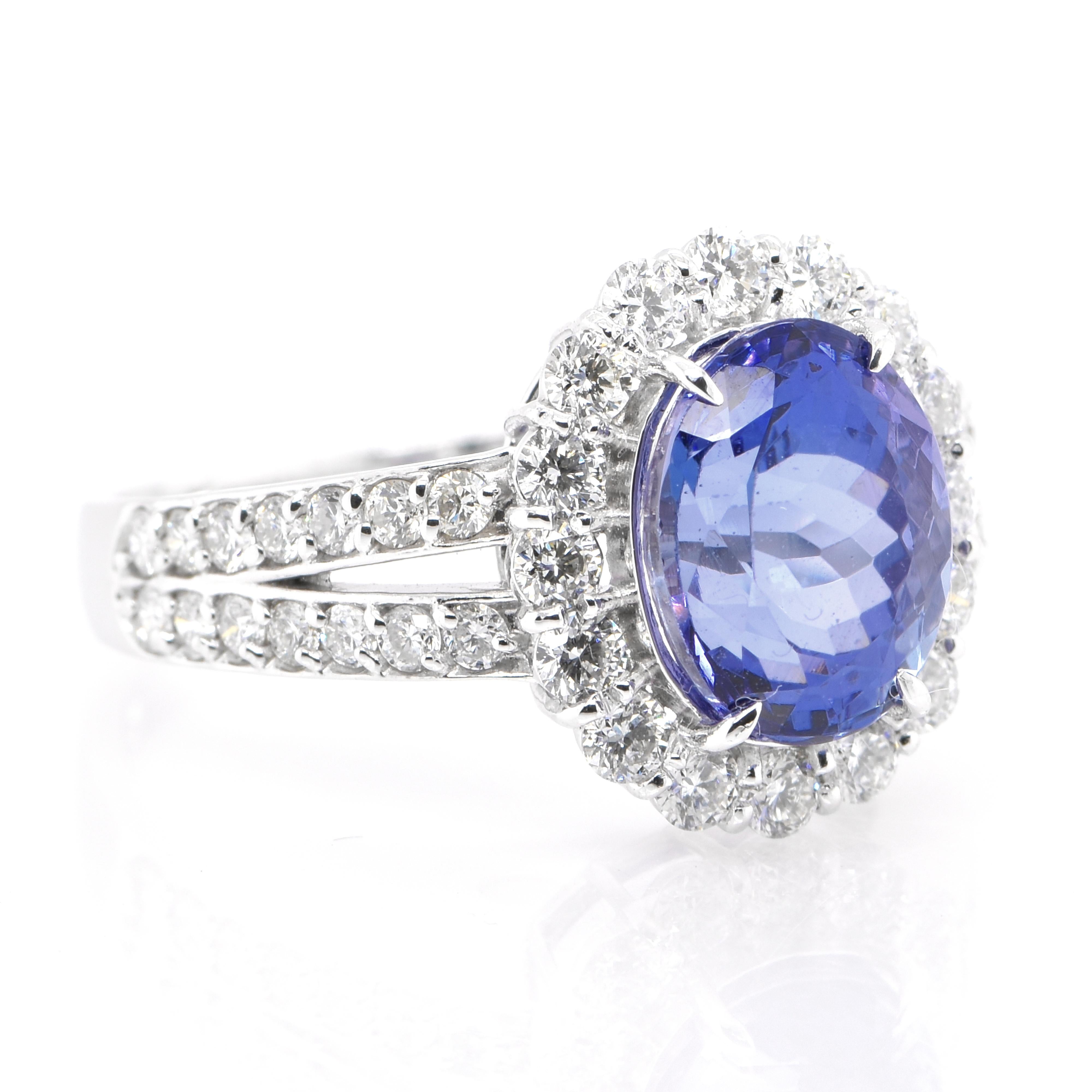 A beautiful ring featuring a 2.78 Carat Natural Tanzanite and 0.83 Carats of Diamond Accents set in Platinum. Tanzanite's name was given by Tiffany and Co after its only known source: Tanzania. Tanzanite displays beautiful pleochroic colors meaning