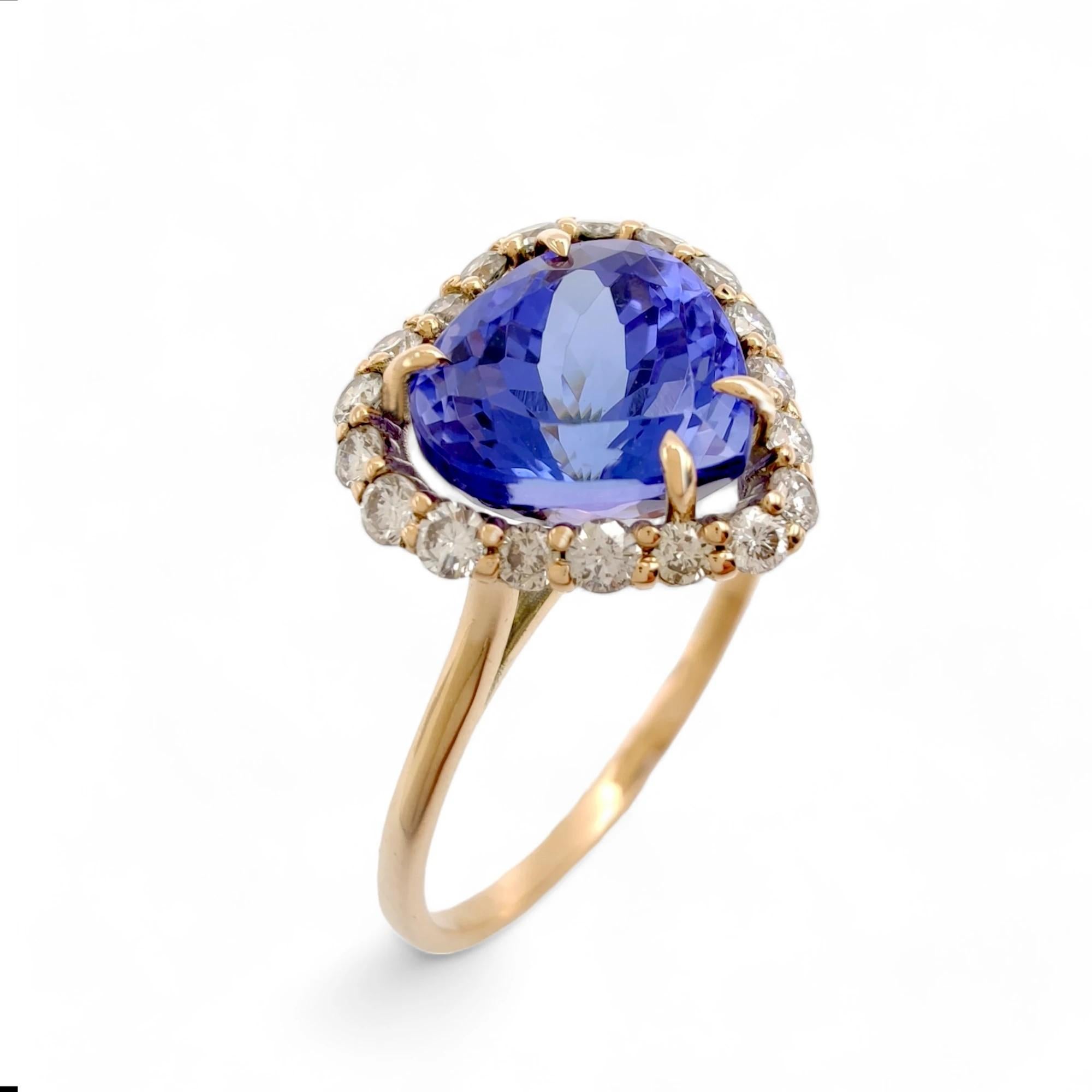 This exclusive engagement ring for women is masterfully crafted in 14K yellow gold, centering a spectacular 2.78-carat natural pear-cut tanzanite. Its intense violet-blue tone and vivid play of color make it a truly one-of-a-kind gemstone.