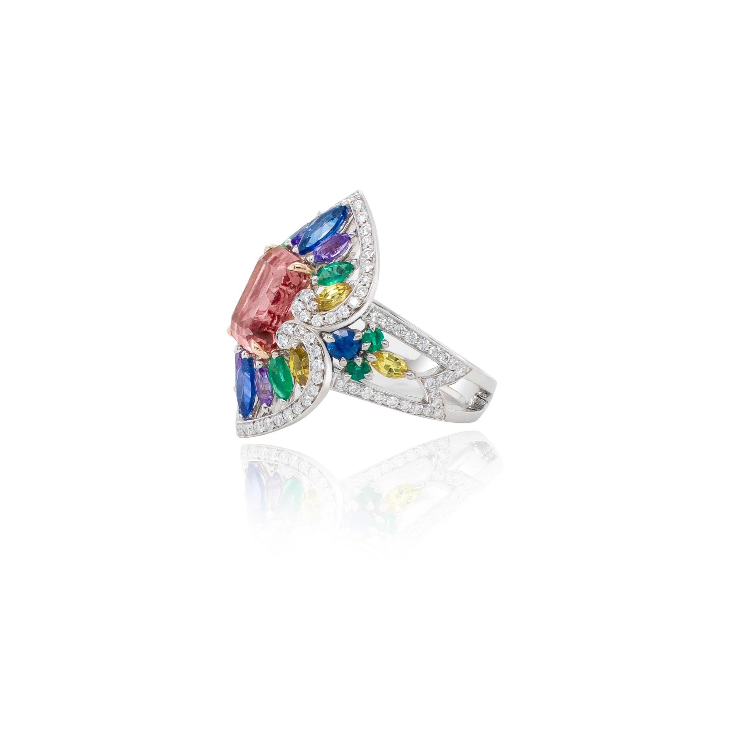 Introducing the Summer Radiance Ring capturing this season's vibrancy and joy. At its heart lies an emerald cut natural pink tourmaline encircled with a blend of colorful sapphires, emeralds and diamonds set in 18k white gold.

This unique design is