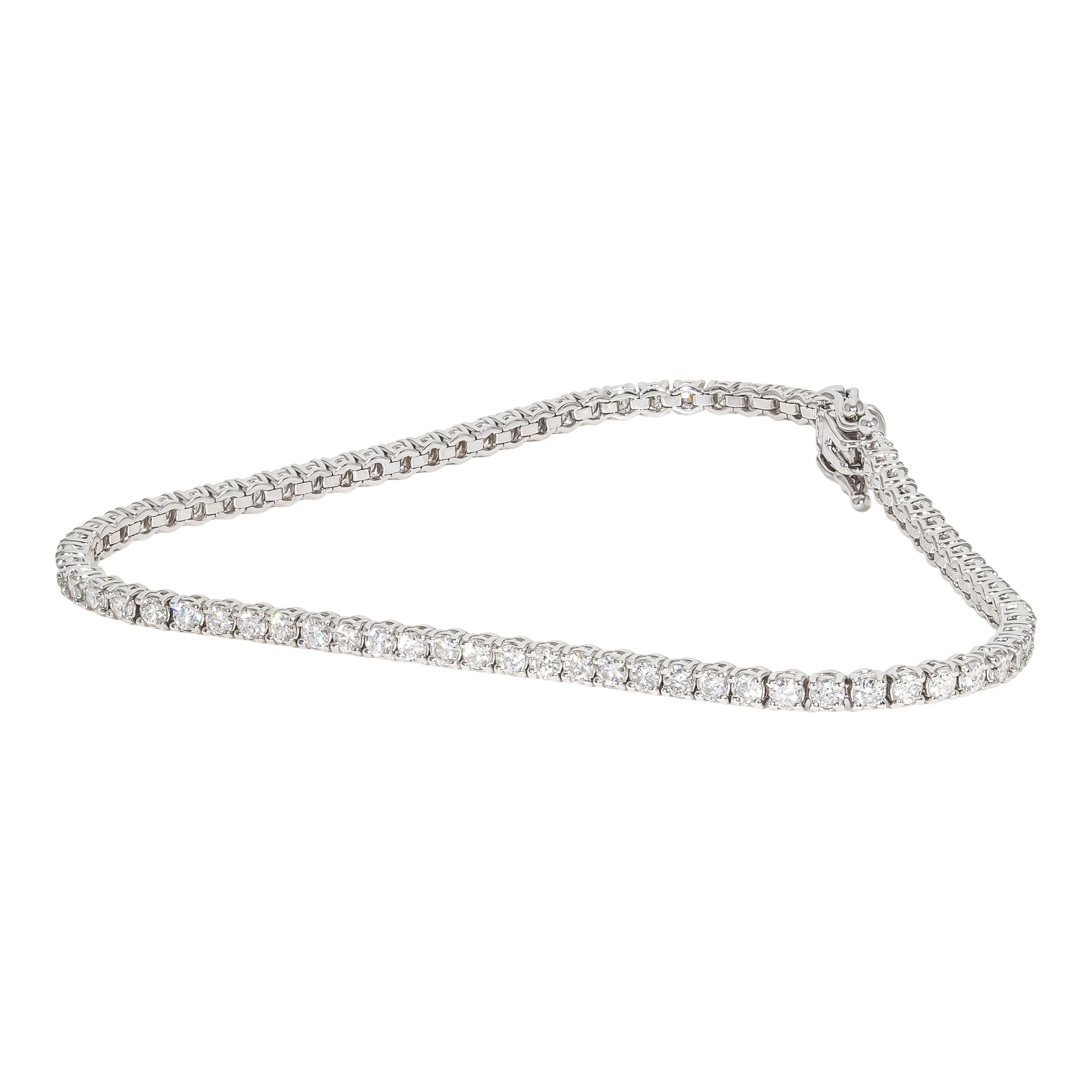 14k white gold bracelet containing 78 prong set natural diamonds. The total weight of the diamonds is 2.78 carats. The color and clarity grades of the diamonds contained within the bracelet have been graded by our Graduate Gemologists as E-F,