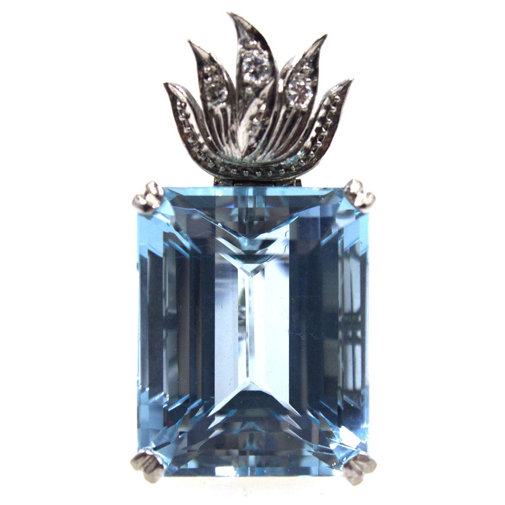 This magnificant aquamarine and diamond pendant features a 27.85 carat aquamarine set with diamonds in 14 karat white gold. The emerald cut aquamarine measures 16 x 20mm and has beautiful blue color with great clarity. The pendant measures 1.25