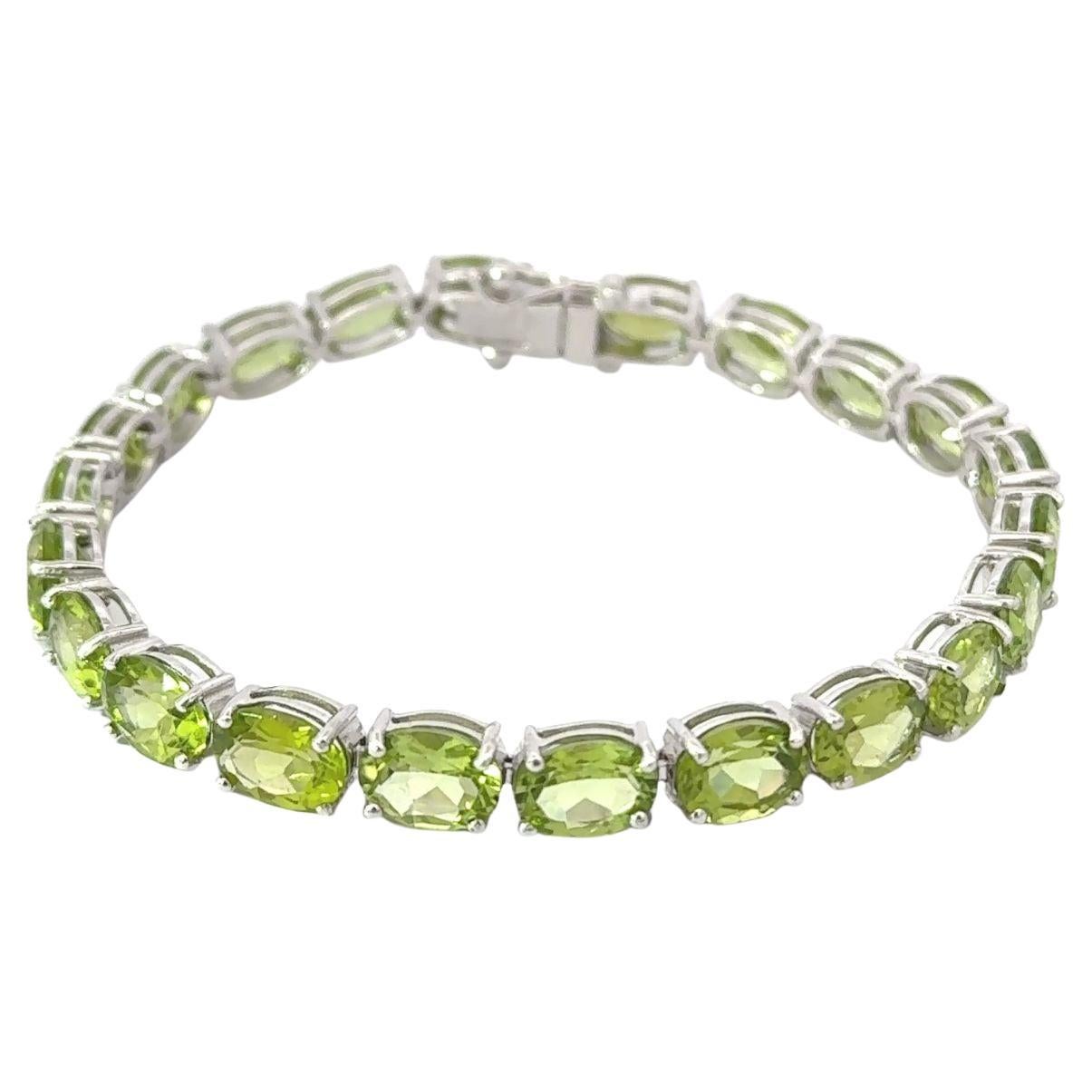 27,85 carati di peridoto taglio ovale in argento 925 Bracciale da tennis per mamma regalo in vendita