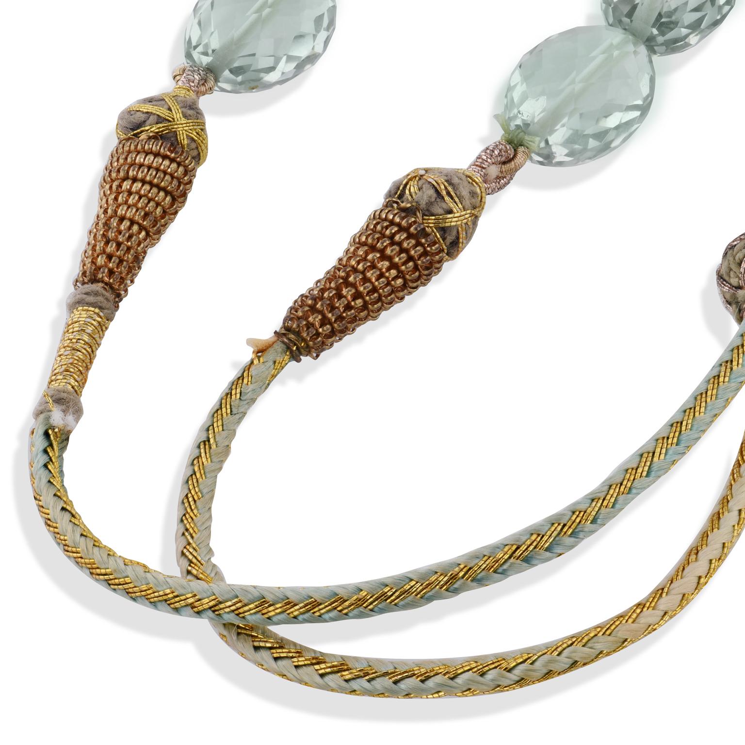 278.73 Carat Sea Green Prasiolite Beaded Necklace with Tassels 

Let the distinctive and attractive color of prasiolite fuel your imagination and inspire your style with 278.73 carats on beaded strand.  At full length, this is a 36 inch necklace,