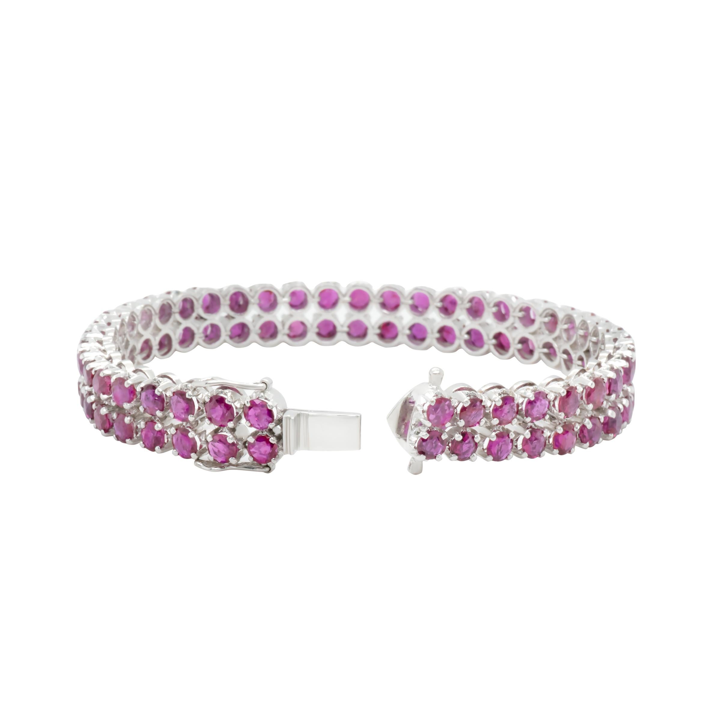 A charming white gold and ruby tennis bracelet.  This two row prong set ruby bracelet is perfectly aligned to create a bold yet delicate piece of jewelry.

Ruby 82 pcs
Size 4.0 mm
Total 27.88 cts

Length: 7.2 inch
Height: 8mm 
