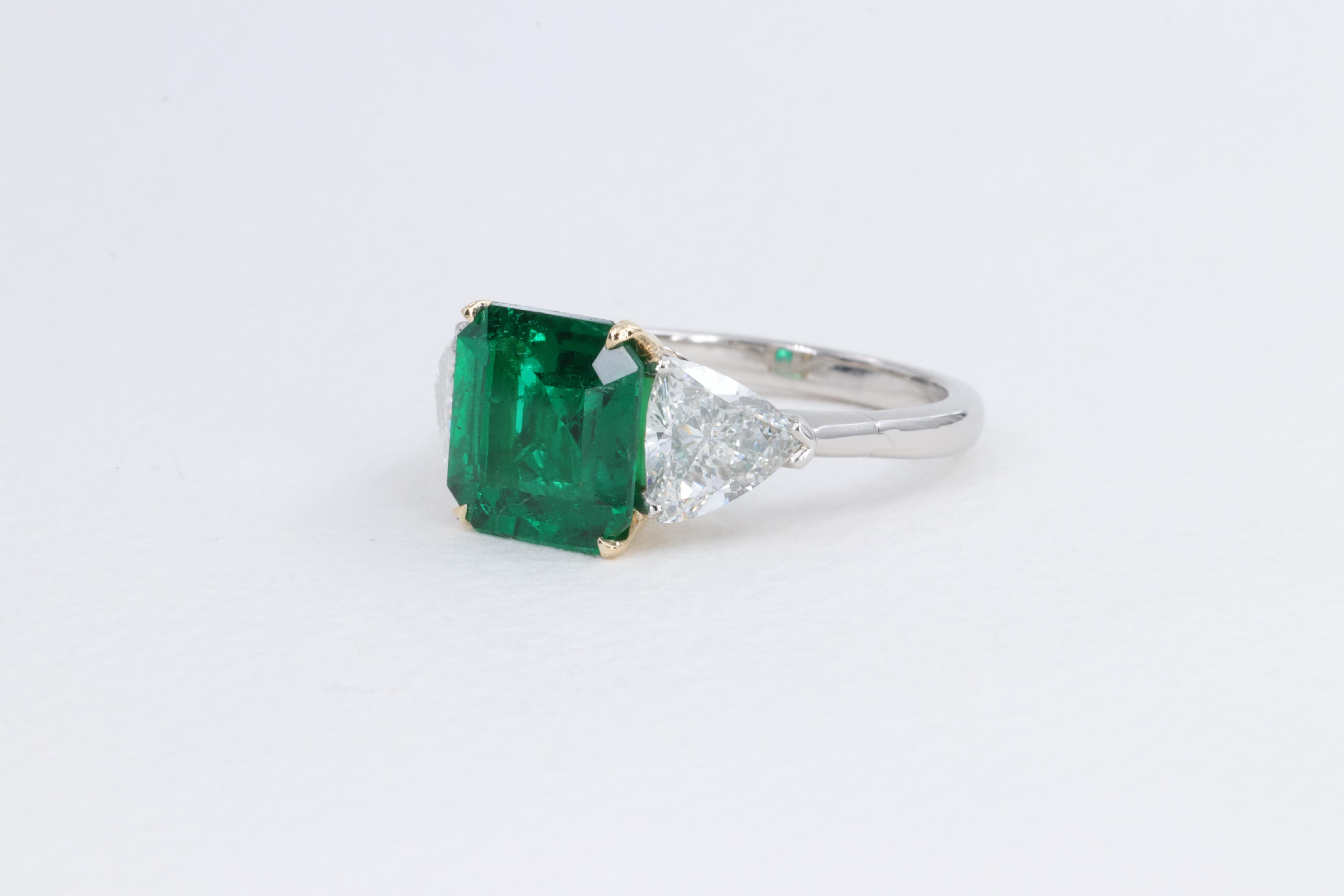 Modern 2.78ct Minor Oil Emerald A.G.L. Three Stone Ring with G.I.A. Trillions