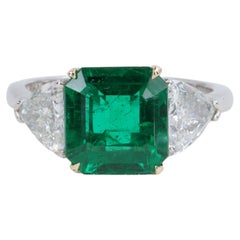 2.78ct Minor Oil Emerald A.G.L. Three Stone Ring with G.I.A. Trillions