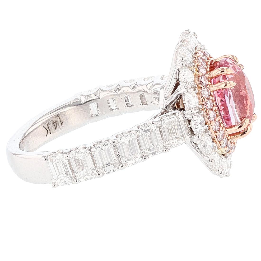 This ring is designed by Nazarelle. It is made in 14K White and Rose gold and features a 2.78ct Padparadscha Sapphire from Sri Lanka and NO HEAT treatment. The mounting features 12 emerald cut diamonds weighing 1.60ct, Color Grade (G) Clarity Grade