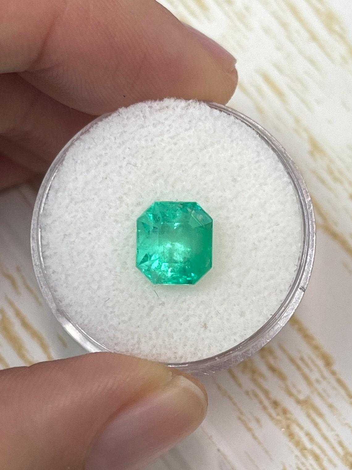 Stone: Emerald
Weight: 2.78-carats
Shape: Asscher Cut
Clarity: Semi-Transparent
Luster: Good
Color: Medium Yellowish Green
Measurements: 8.53mm x 7.86mm x 7.04mm
Geographic Origin: Colombia
Treatment: Natural, Oiling

Comments: Due to their growth