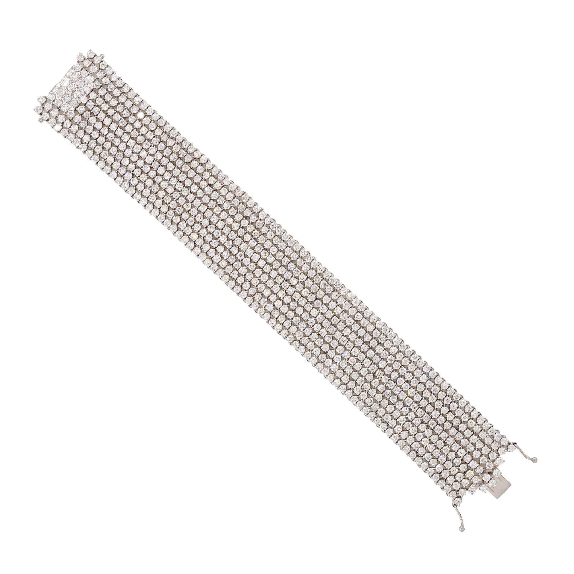 Style: Wide, 9 Row, Diamond Tennis Bracelet 
Material: 18 Karat White Gold
Diamond Details: Approximately 27.90 carats of Round Brilliant cut diamonds. Total of 648 diamonds.
Diamond Clarity: VS/SI (Very Slightly Included to Slightly