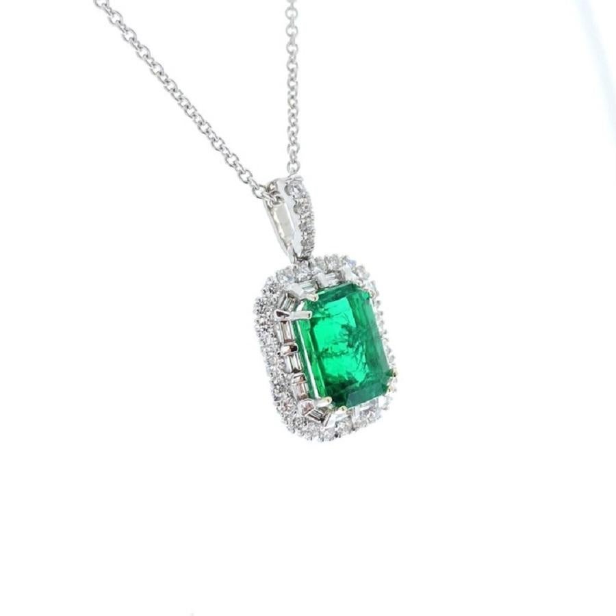 This pendant is a stunning embodiment of sophistication and grace. Crafted in 18 karat white gold, it features a captivating 2.79 carat emerald-shaped green emerald as its focal point. The emerald's deep green hue is truly mesmerizing, exuding a