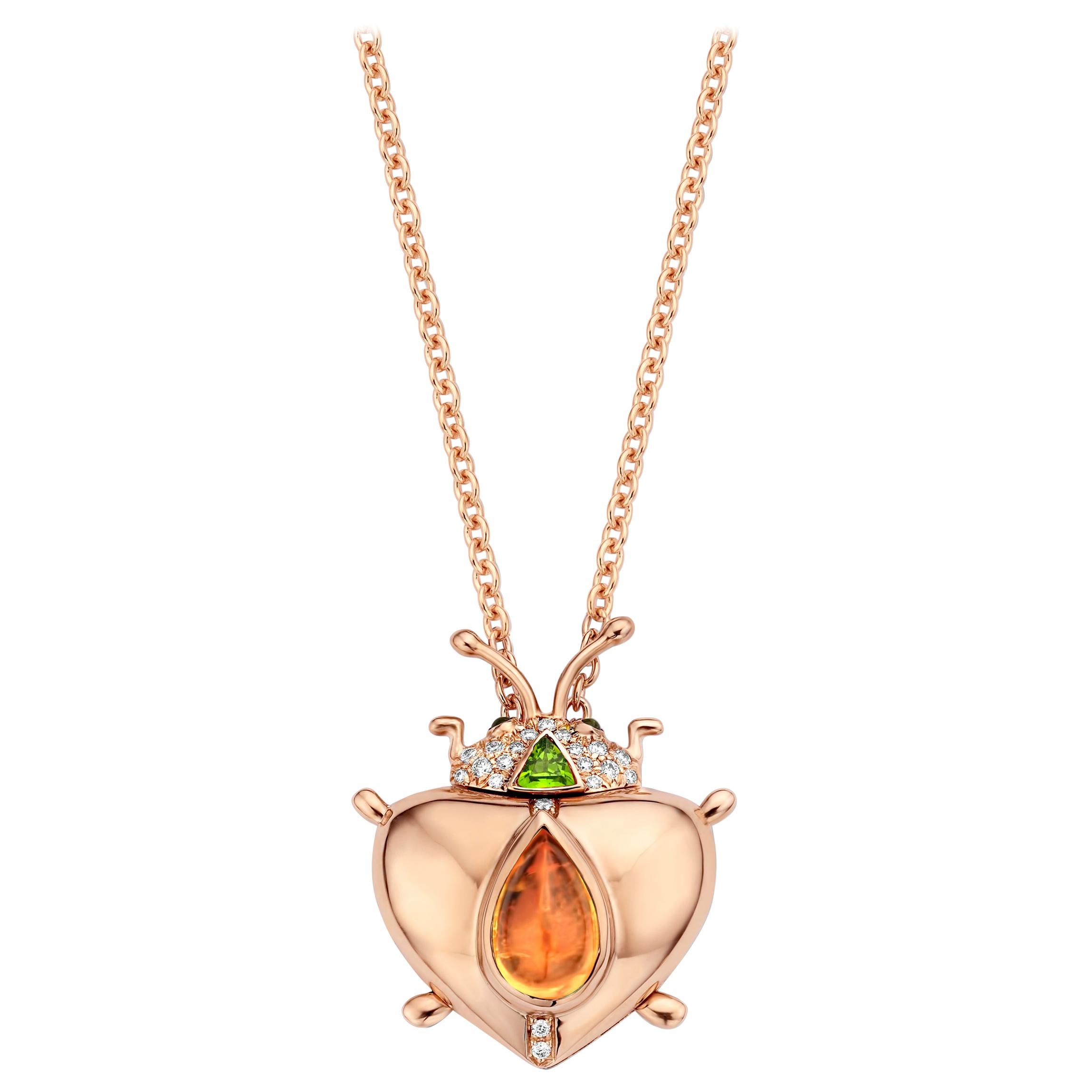 One of a kind lucky beetle necklace in 18K rose gold 17,6g set with the finest diamonds in brilliant cut 0,14Ct (VVS/DEF quality) and one natural, Mandarin garnet in pear cabochon cut 2,79Ct. The head and eyes are set with tsavorites in round
