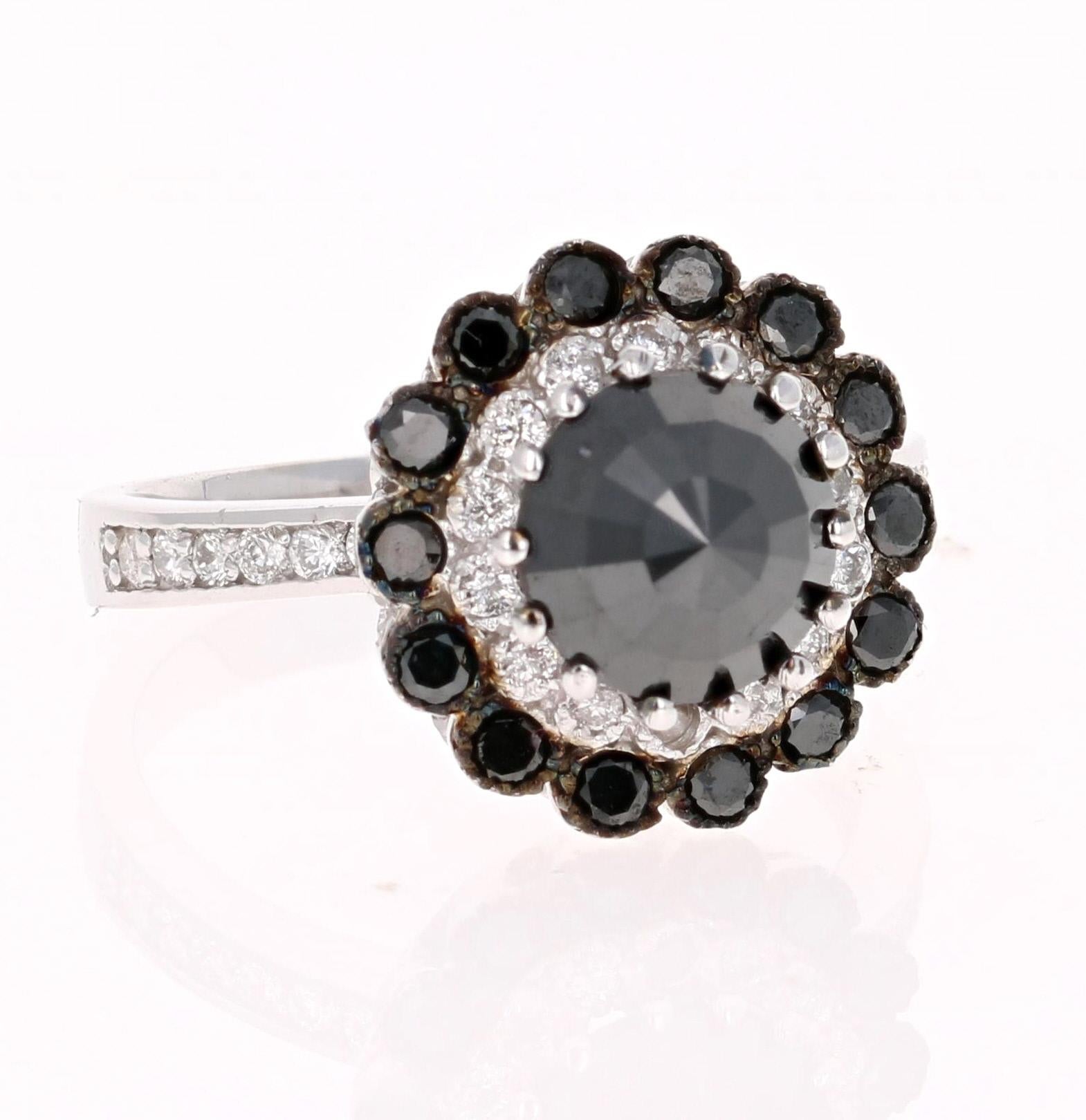2.79 Carat Pear Cut Black Diamond White Gold Bridal Ring!
Gorgeous Black Diamond Ring that can transform into an Engagement ring.  

There is a 1.73 carat Round Cut Black Diamond in the center which is surrounded by both Black and White Round Cut