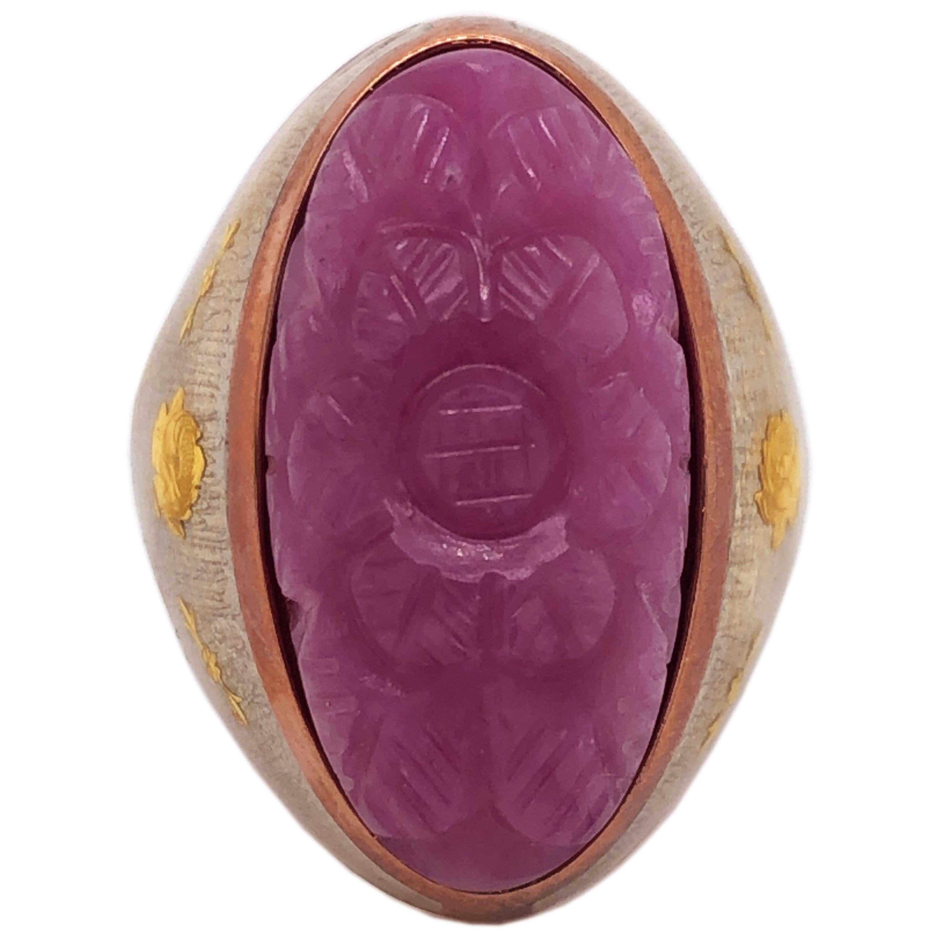 Contemporary, Unique yet Chic Cocktail Ring Featuring a 27.95 Kt Natural Hand Carved Pink Sapphire Cabochon in a 24kt Yellow Gold Roses and Leaves Hand Enameled Sterling Silver Rose Gold Plated Setting.
Awesome, One-of-a-kind Hand Carved Pink