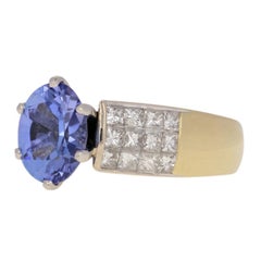 2.79 Carat Oval Cut Tanzanite and Composite Diamond Ring, 18 Karat Yellow Gold