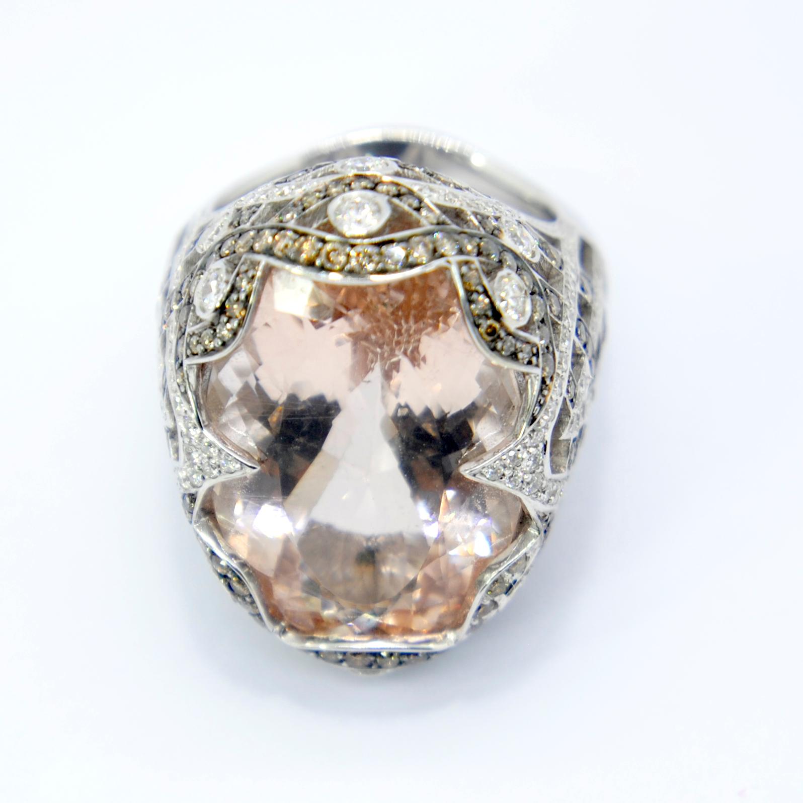 Fabolous and Elaborate craftmanship for an Oval shape 27ct Morganite 
mounted in white 18K Gold  with white and Champagne Diamonds that total 1,85ct 
Ring Size : US7 equivalent  54
Ring size can be adjusted Irama Pradera is a Young designer from