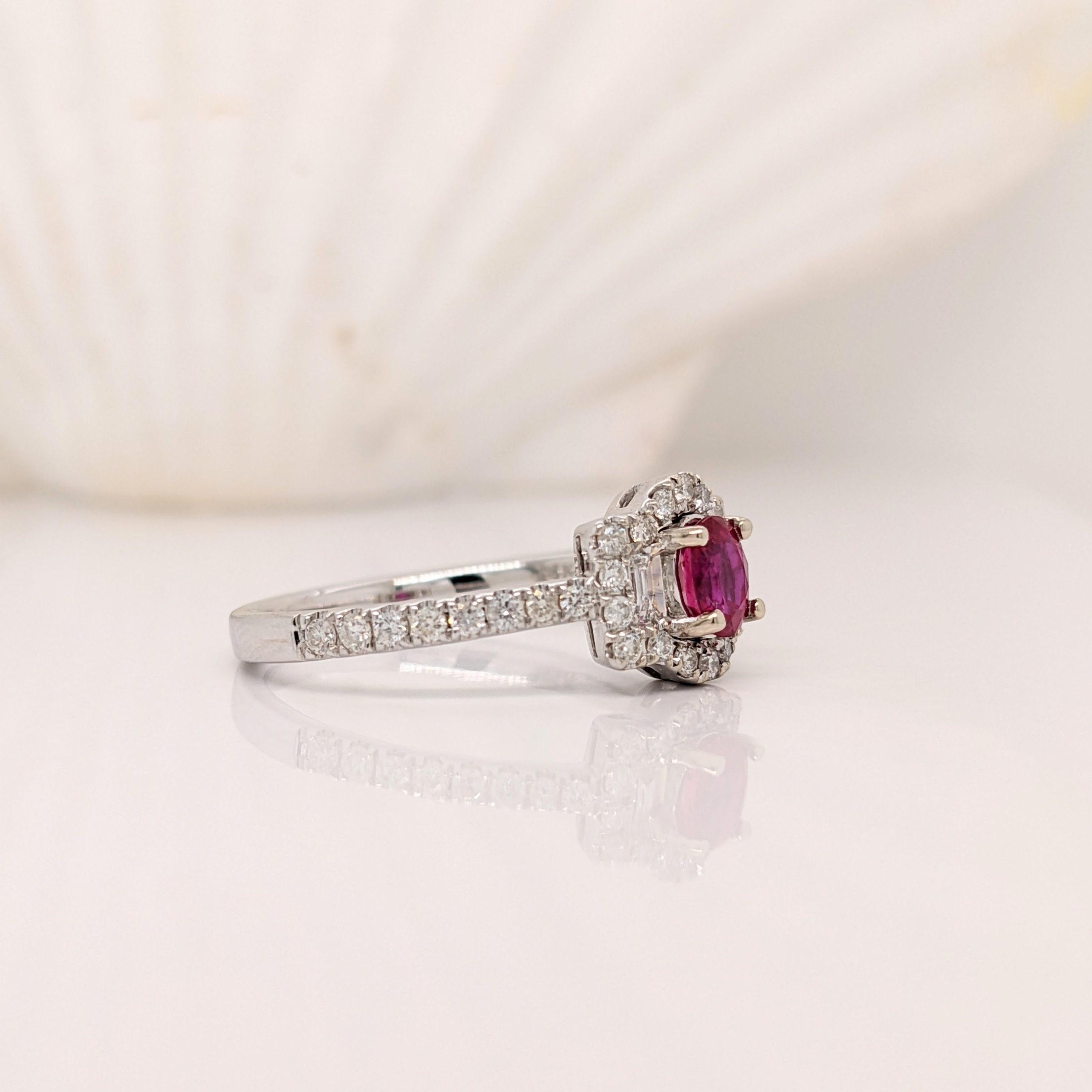 This gorgeous cherry red ruby comes from Mozambique and looks stunning in a classic NNJ Design's semi mount with baguette diamond accents and a pave diamond halo and shank.  A polished design that looks good on anyone! Pair this gorgeous ruby with