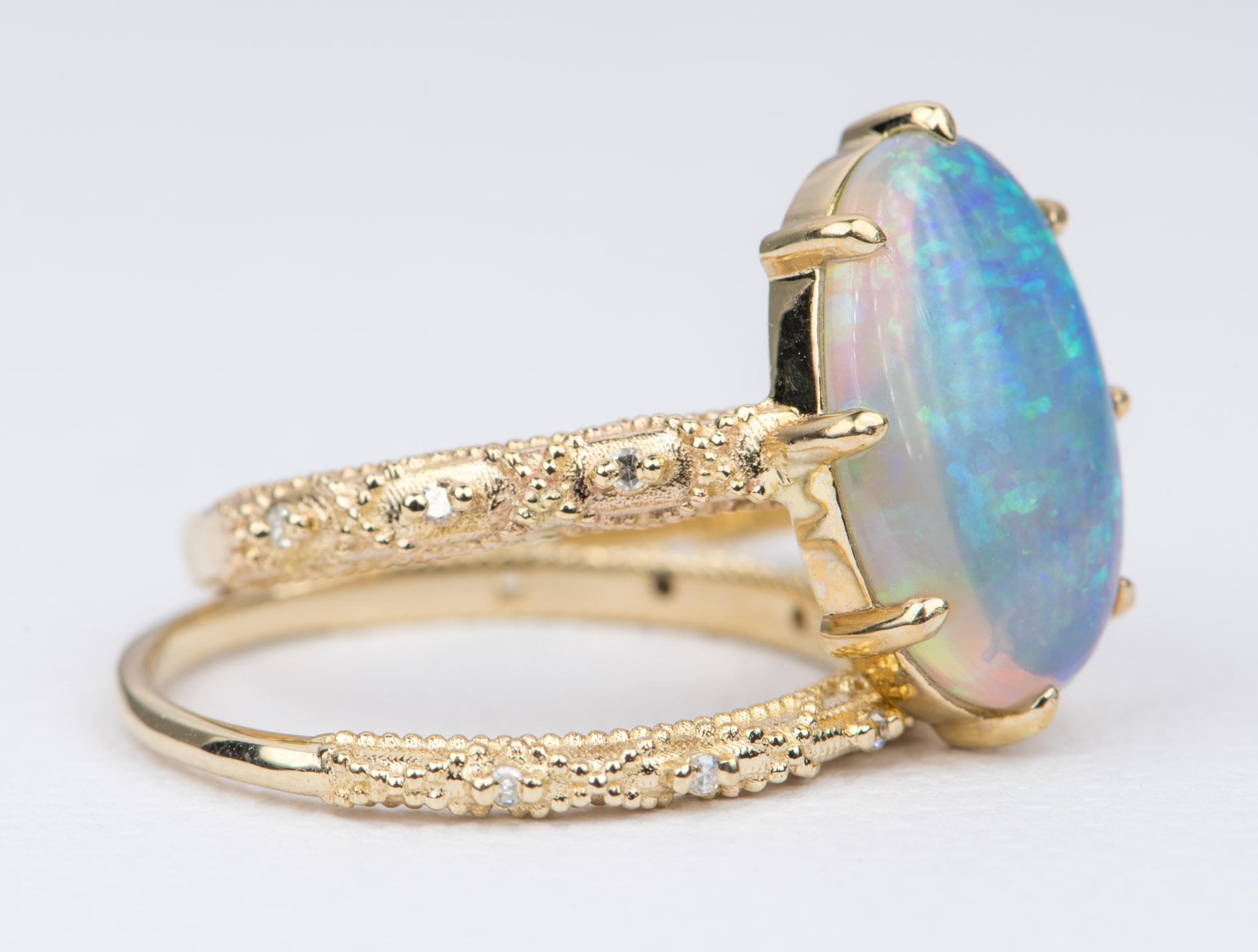 ♥♥♥♥ This listing is sold and priced as a set ♥♥♥�♥

♥  A solid 14k yellow gold ring set with a beautiful oval shape Australian opal, set on a vintage-inspired lace filigree band to accent the center stone 
♥  The engagement ring is paired with a