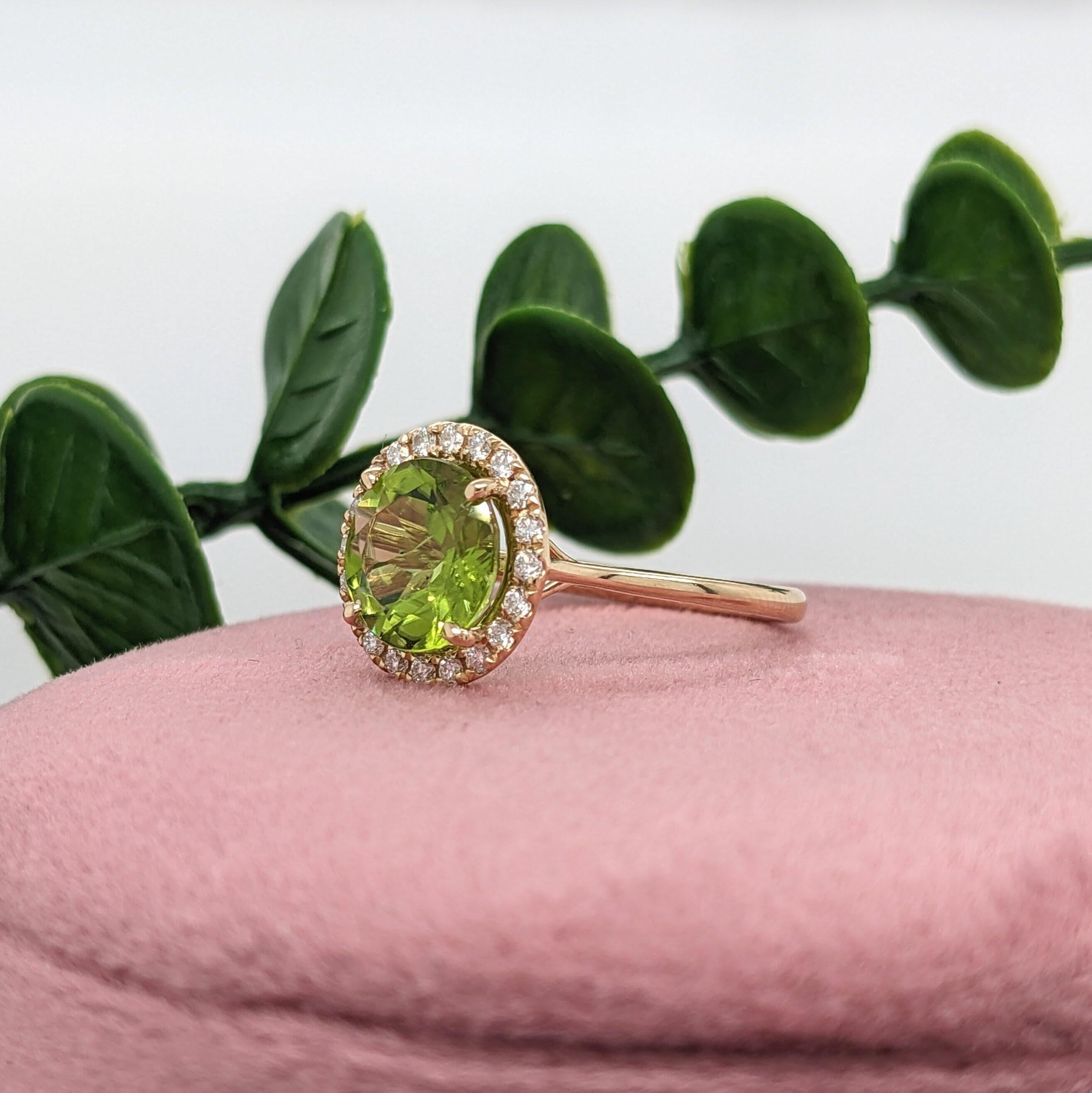 This beautiful ring features a 2.7ct sparkling round peridot in a stunning setting made in solid 14k gold with a halo of all natural earth mined diamonds. Enjoy the gorgeous shade of green and beautiful clarity of this natural peridot! This ring