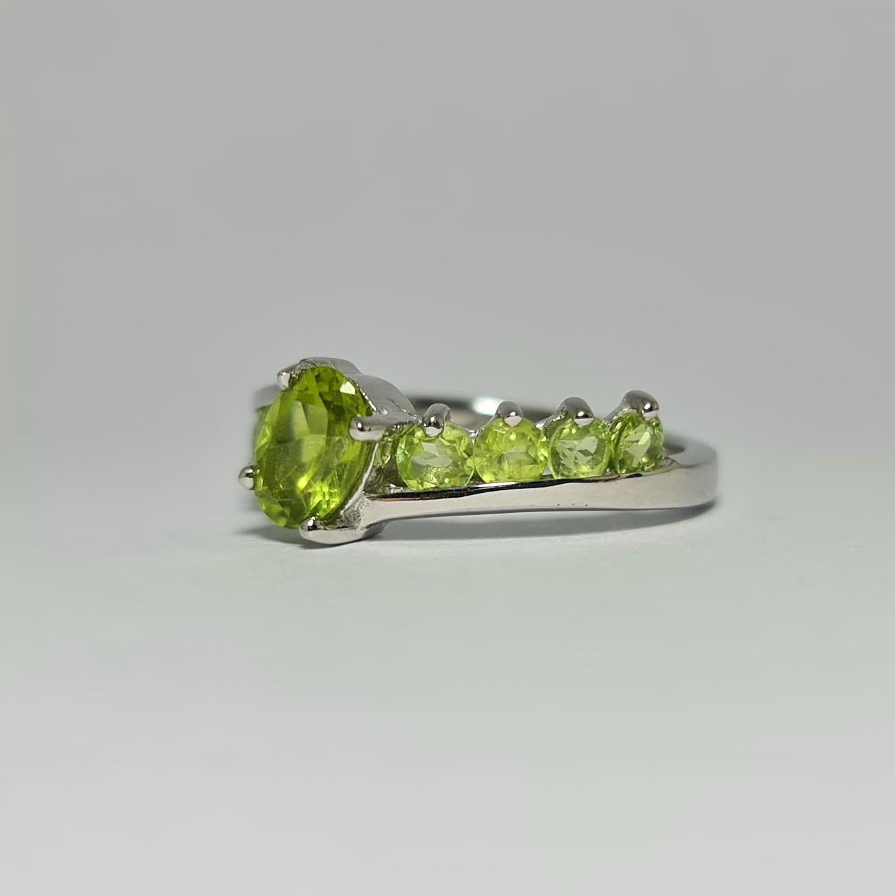 Oval Cut 2.7Cts Natural Peridot .925 Sterling Silver Rhodium Plated Ring For Sale
