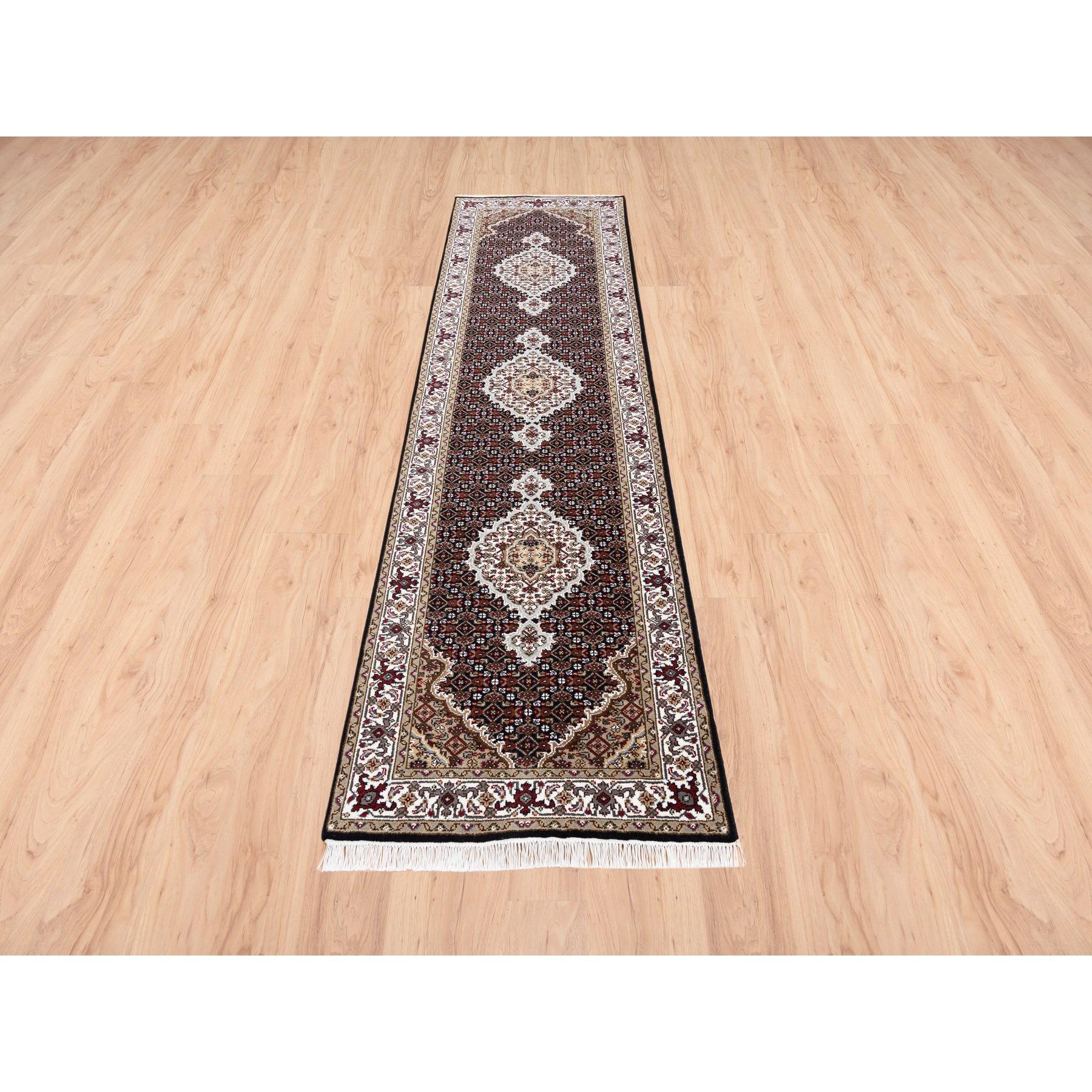 This is a truly genuine one-of-a-kind Hand Knotted Fish Medallion Design Tabriz Mahi Black Wool Oriental Runner Rug. It has been Knotted for months and months in the centuries-old Persian weaving craftsmanship techniques by expert artisans.
Primary