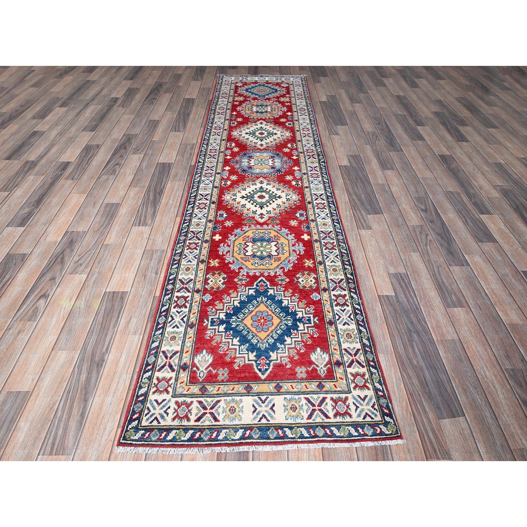 Arsenal Red, Kazak with Tribal Medallions Design, Hand Knotted, Soft and Vibrant Wool, Vegetable Dyes, Denser Weave, Runner, Oriental Rug
Primary materials: Wool
Latex: No Pile 
height: 0.25 Inches
Style: Traditional
Primary color: Red
Secondary
