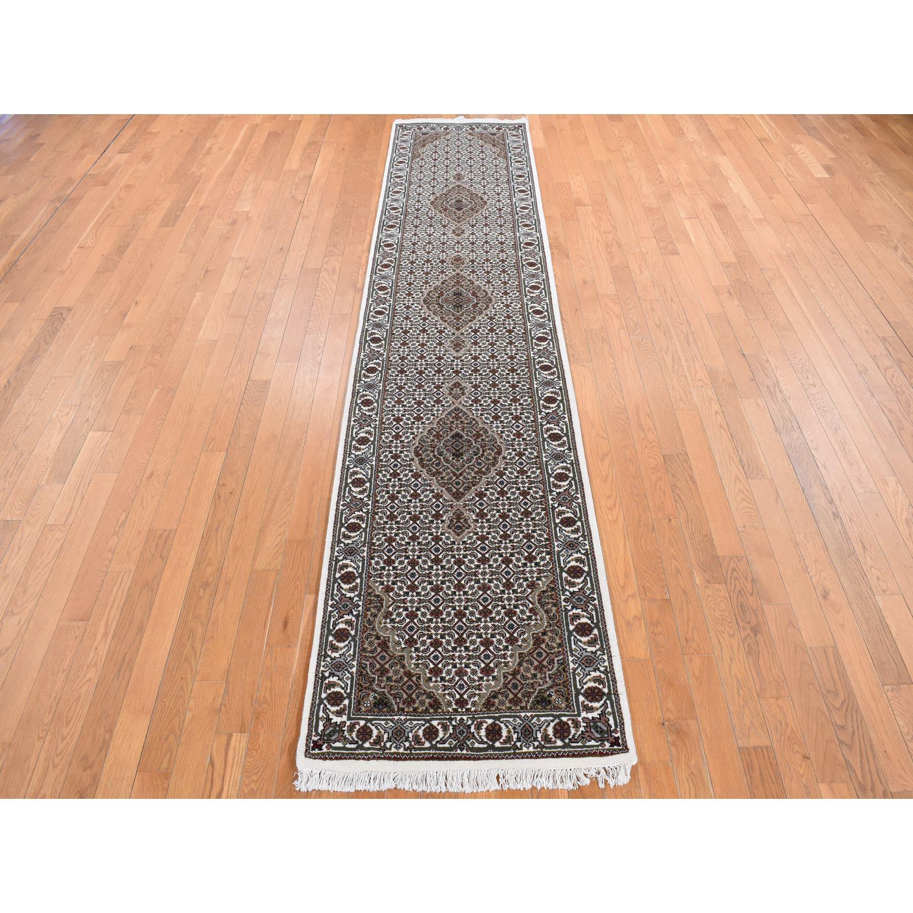 Ivory, Wool and Silk, Tabriz Mahi Medallion Design, Hand Knotted, Runner Oriental Rug
Primary materials: Wool & Silk
Latex: No Pile 
height: 0.25 Inches
Style: Traditional
Primary color: Ivory
Secondary colors: Green, Red, Brown, Yellow,
