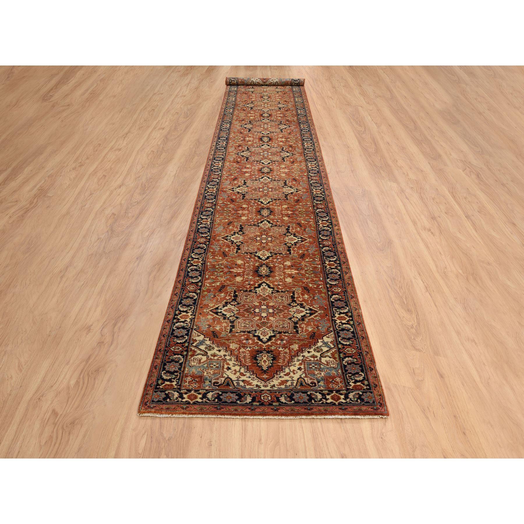 This is a truly genuine one-of-a-kind Terracotta Red, Antiqued Fine Heriz Re-Creation Densely Woven, Natural Dyes Soft Wool Hand Knotted, XL Runner Oriental Rug. It has been Knotted for months and months in the centuries-old weaving craftsmanship